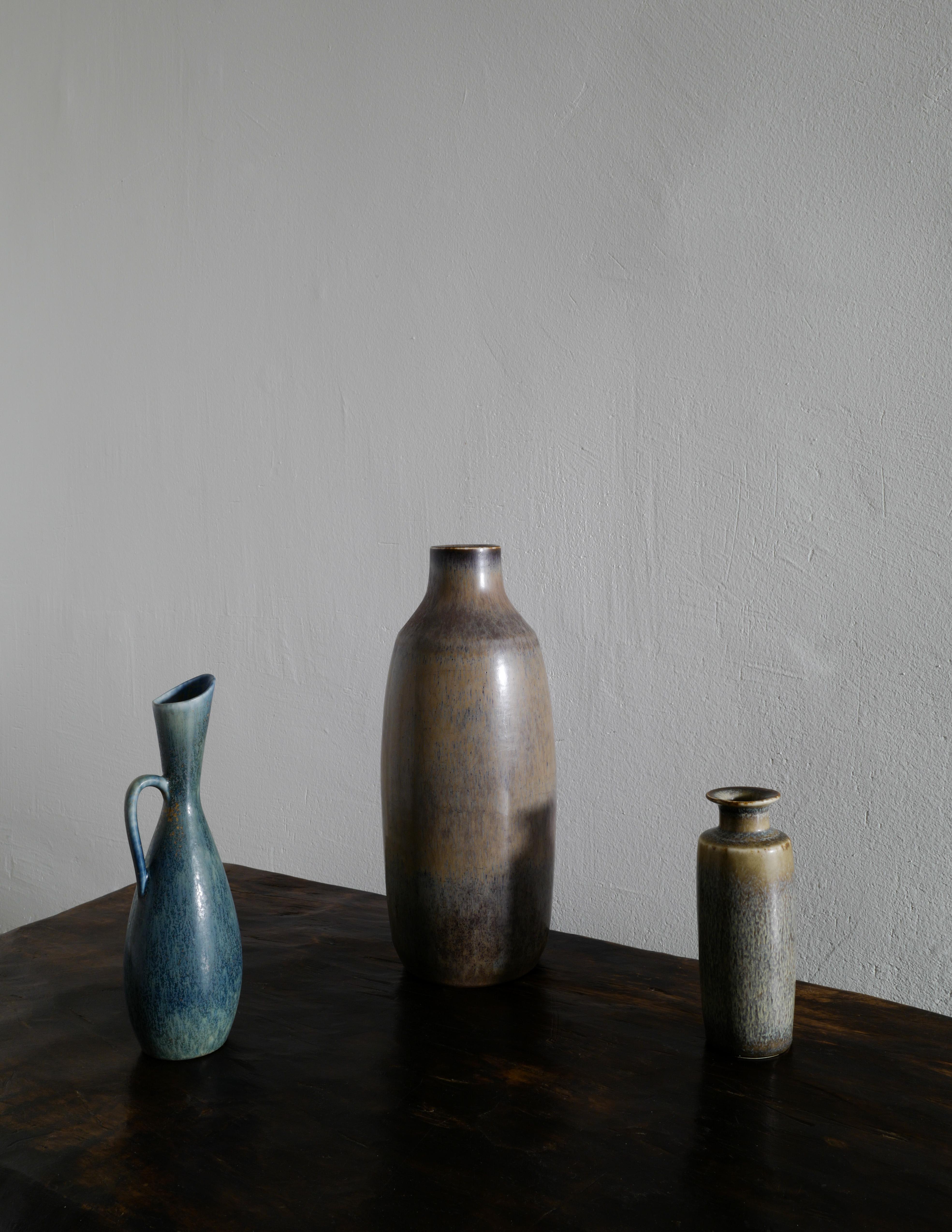 Great and rare trio of Carl Harry-Stålhane mid-century ceramics produced by Rörstrand Studio in Sweden during the 1950s. All three pieces are in great vintage condition and showing minimal signs from age and use.

Dimensions: 
Large one: height: