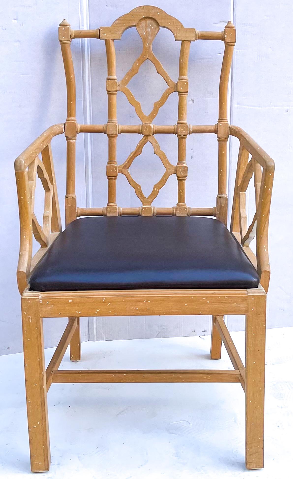 This is a mid-century cerused pine Chinese chippendale style arm chair with expresso brown leather seat. It is unmarked and in very good condition. Arm; 27”.