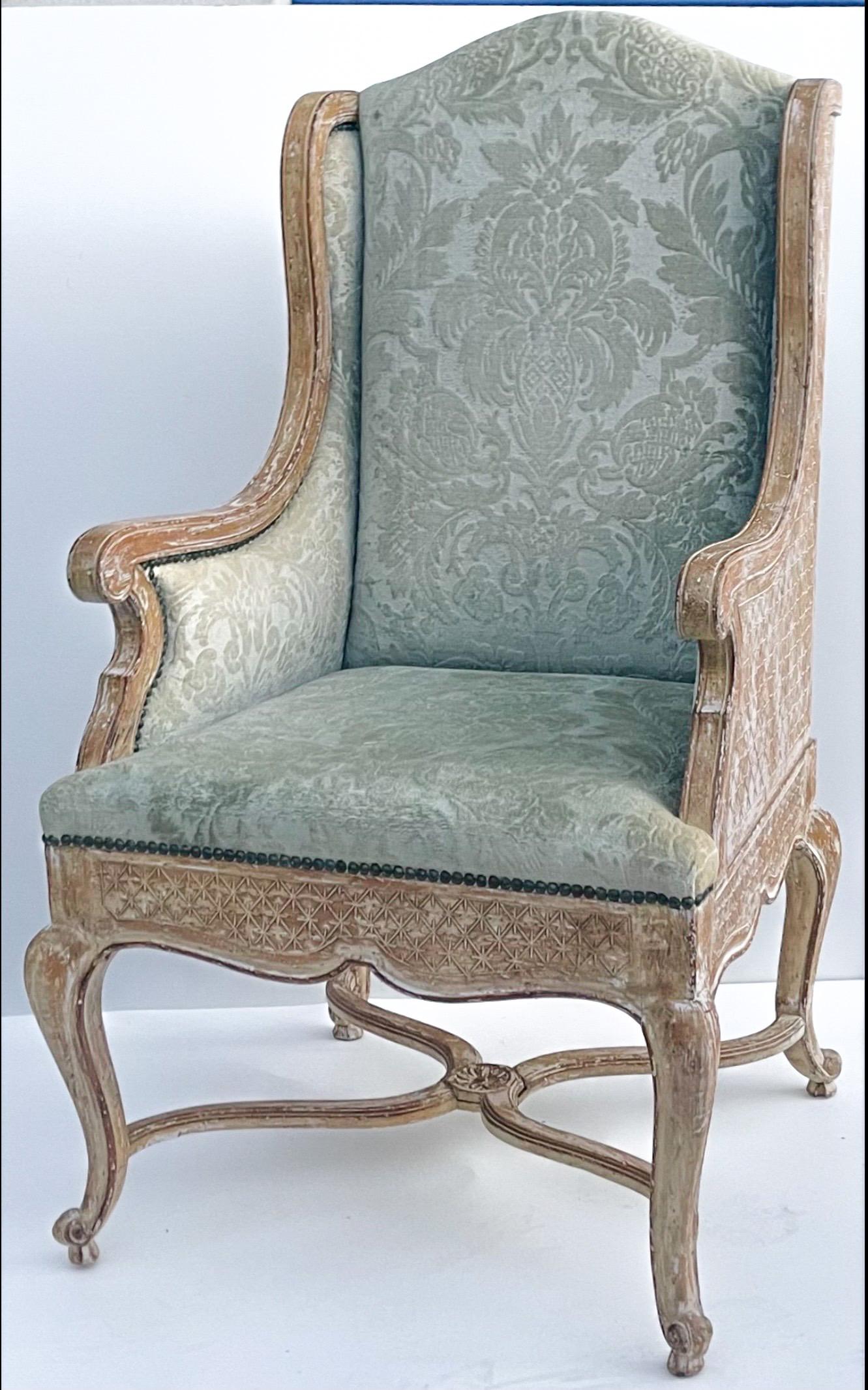 This is a killer chair! The cerused finish is original as is the celadon cut velvet. The velvet is vintage and shows moderate wear. Patina! It is unmarked. Arm; 27.5 Seat; 20”. I am estimating this piece dates to the late 60s or early 70s.

My