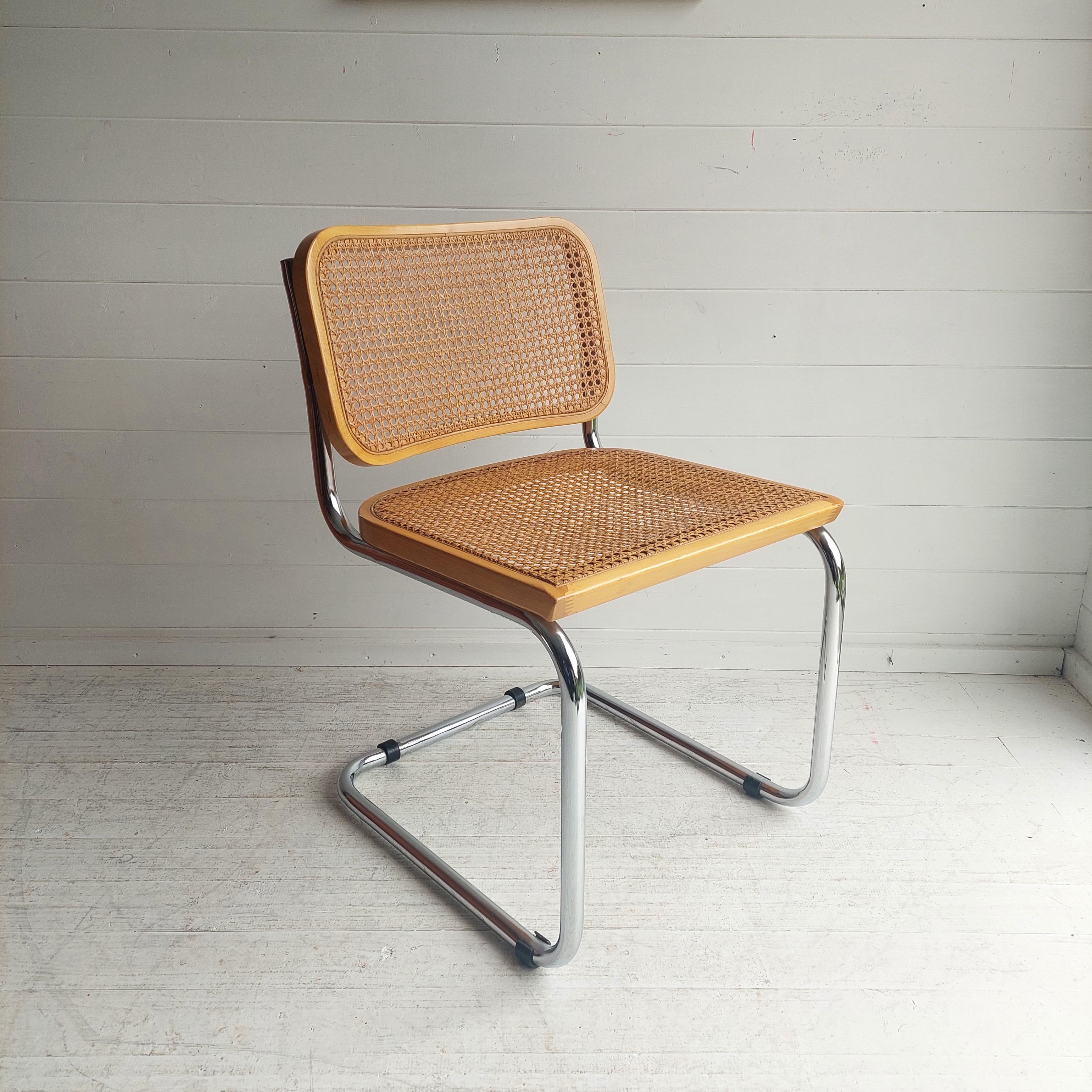 A chair, influenced by Marcel Breuer's Cesca chair (also known as the B32 chair), designed in the 1920's.
This chair dates from the 1970/80's, was made in Italy.

Features:
The chrome tubular frame
The beech frame with a lovely mellow colour.
Cane