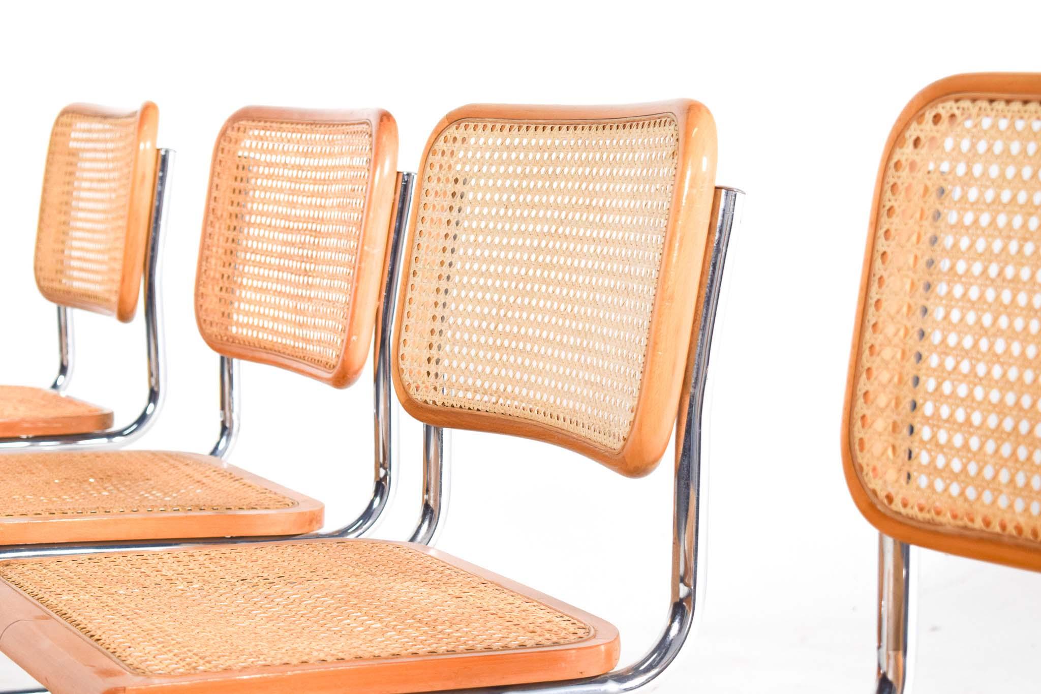 Set of 4 dining Cesca chairs designed by Marcel Breuer in 1928 and produced since that year till today. Chrome plated tubular frame, seat and back with rattan and frame in natural beech wood make the chair more flexibility and comfort. Cesca was the