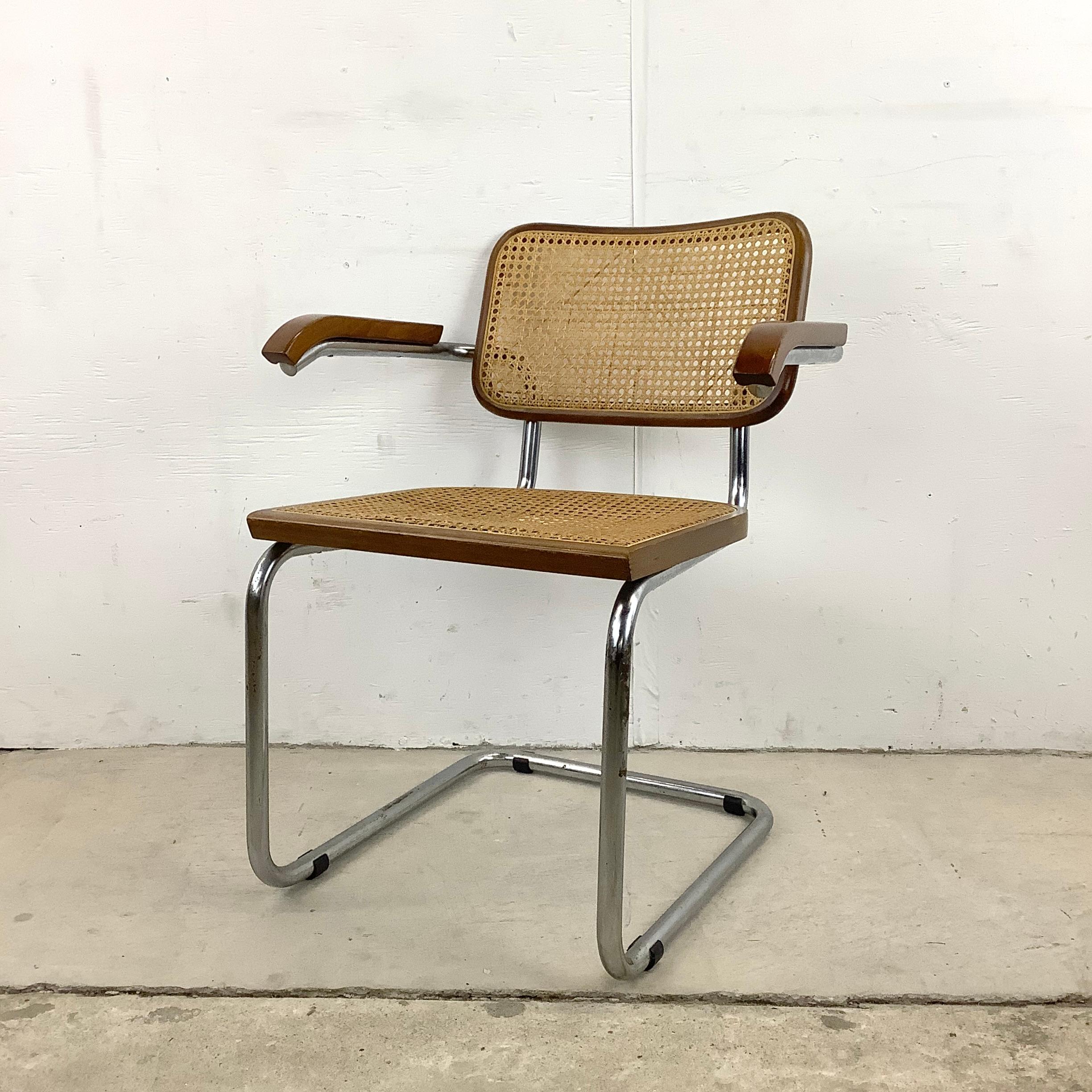 This stylish vintage modern dining chair features tubular chrome frame, cane seat back, and vintage cane seat. The stylish mid-century modern design of this armchair makes an impressive and comfy addition to any dining set or office/waiting room