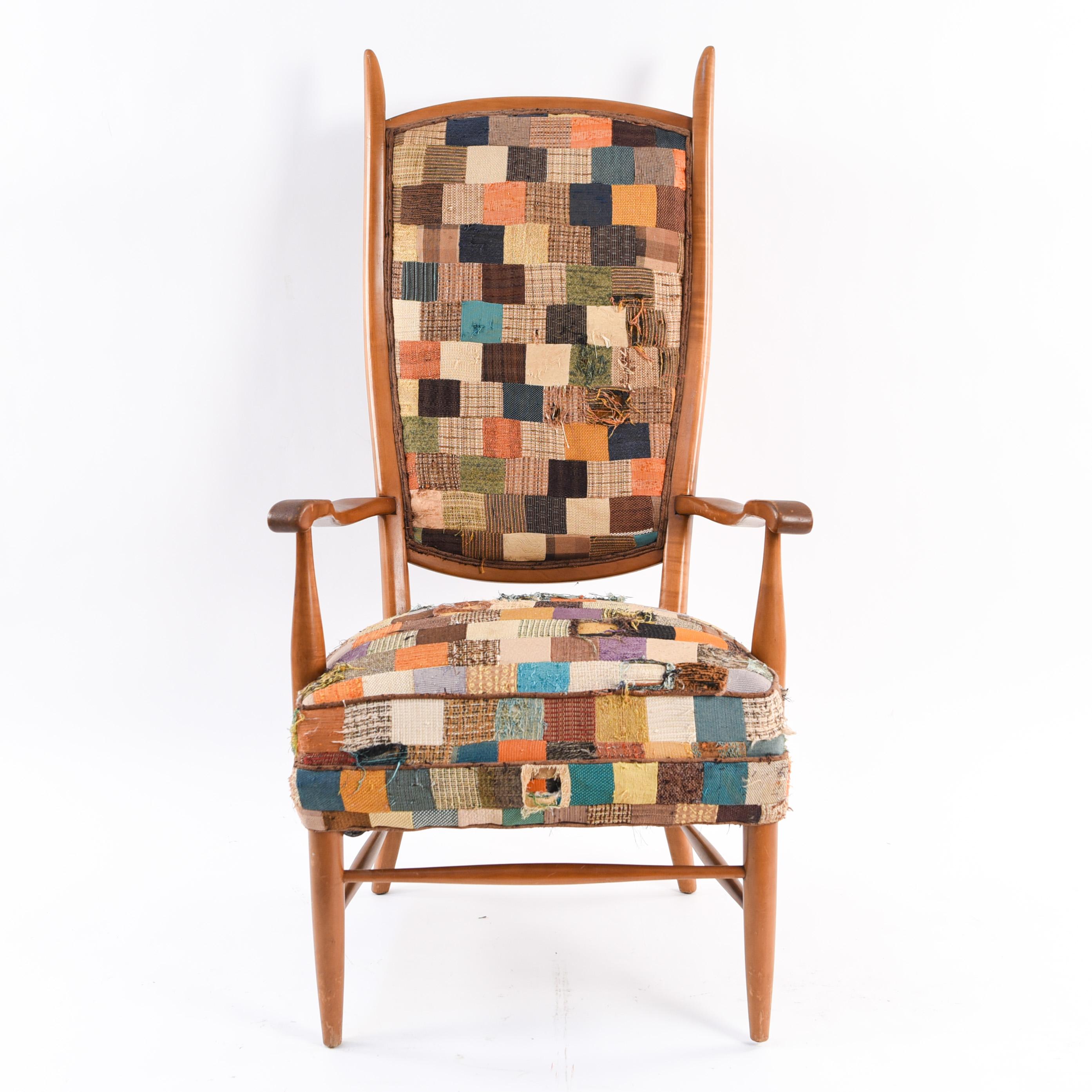 This modern chair has a high back design with interesting lines in the frame. With unique patchwork upholstery.