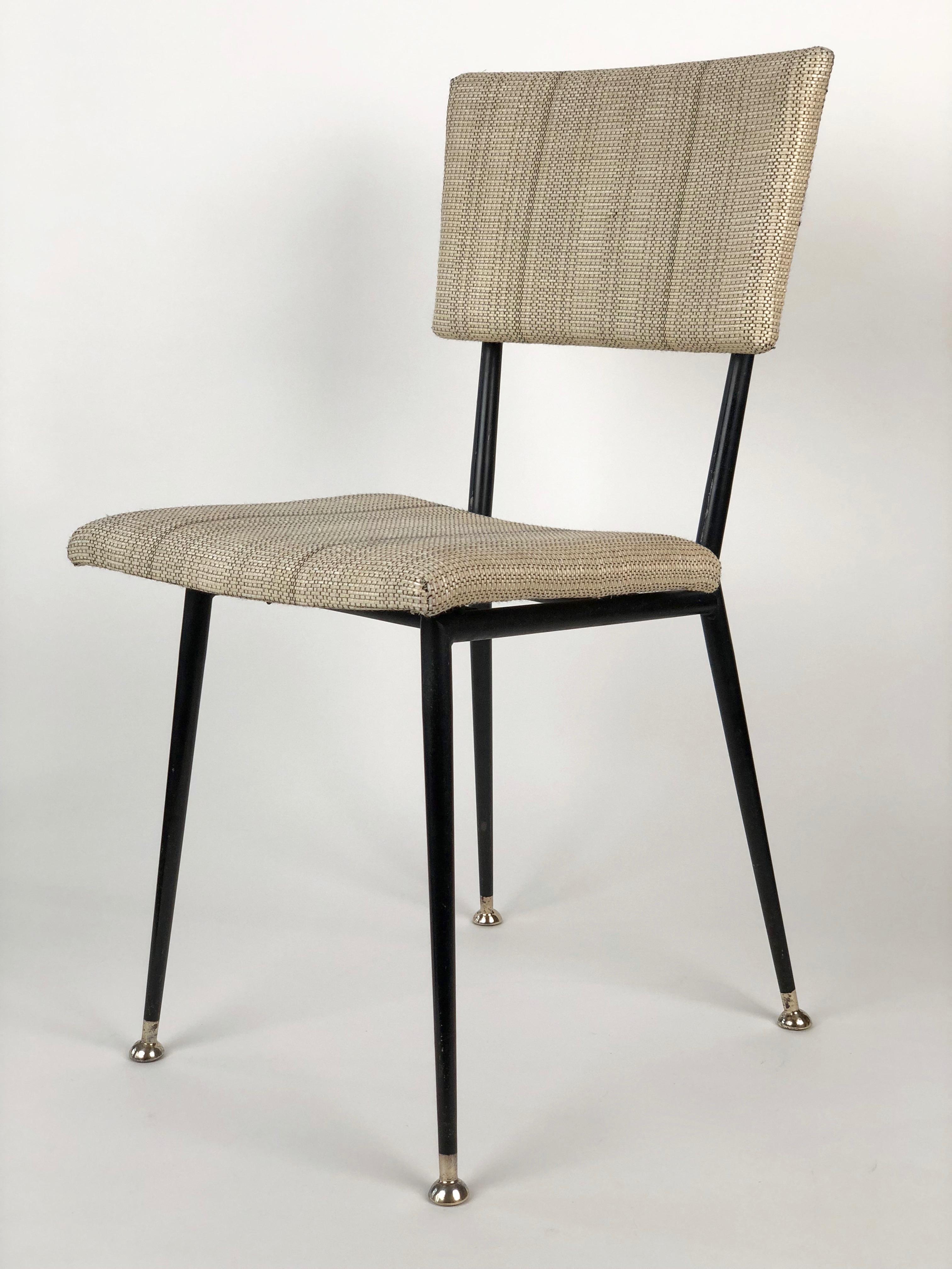 Midcentury chair from Sonnet, Austria is composed of metal tubing brazed together. The legs are tapered and end with brass feet.
Contrasting black and white upholstery matches well with the black frame.