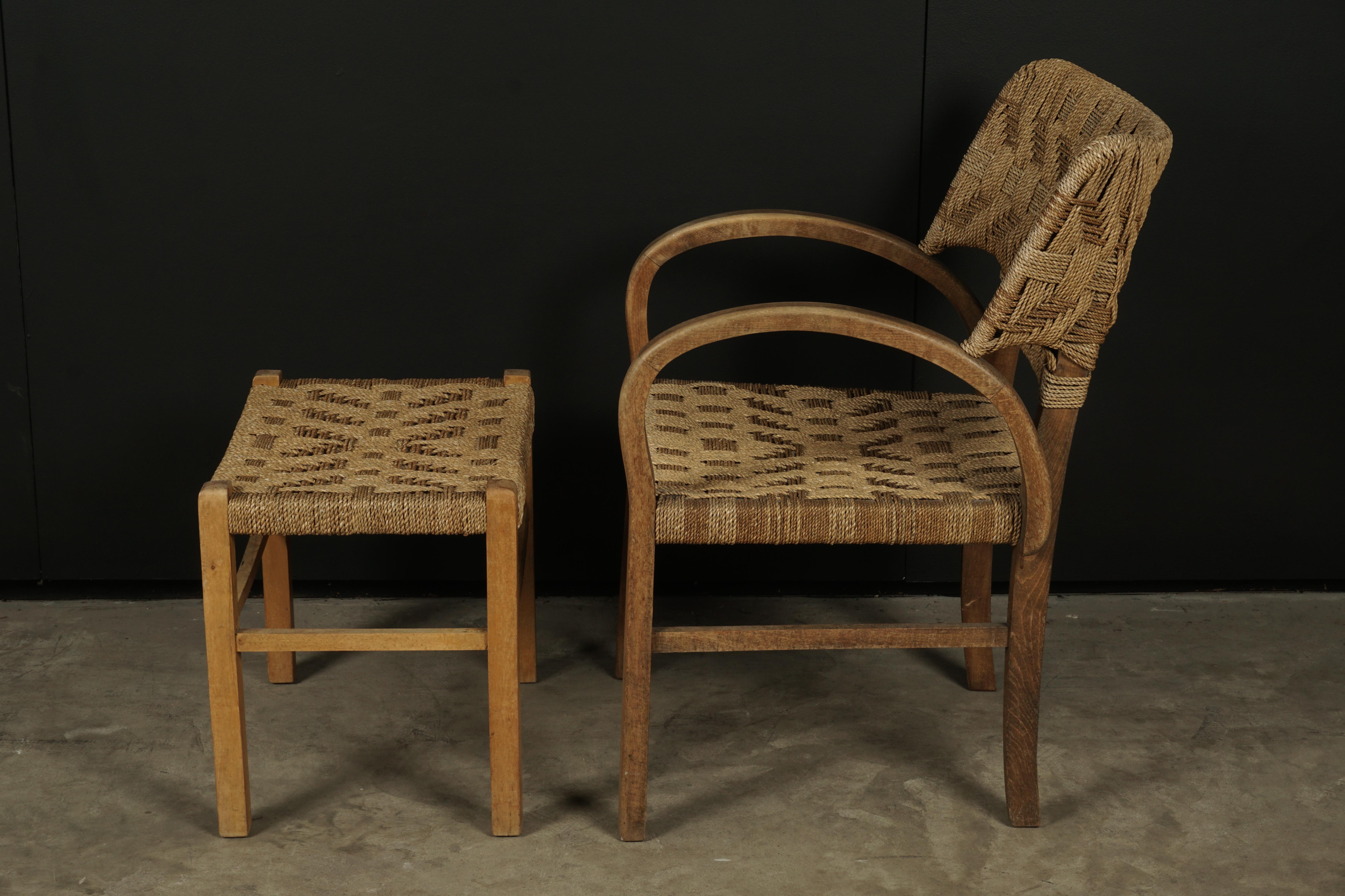Midcentury chair with ottoman from Holland, circa 1960. Bentwood birch frame with woven paper cord seat and back. Nice wear and patina. Ottoman: H-16.5 / W - 19.5 / D - 14.