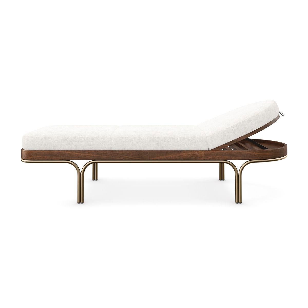 The chaise introduces a relaxed yet refined aesthetic to living interiors. Covered in a soft, wool-like fabric with a sleek base in Natural Walnut and Lucent Bronze Metallic paint.

Take note: the headboard pivots from sleep to recline position for