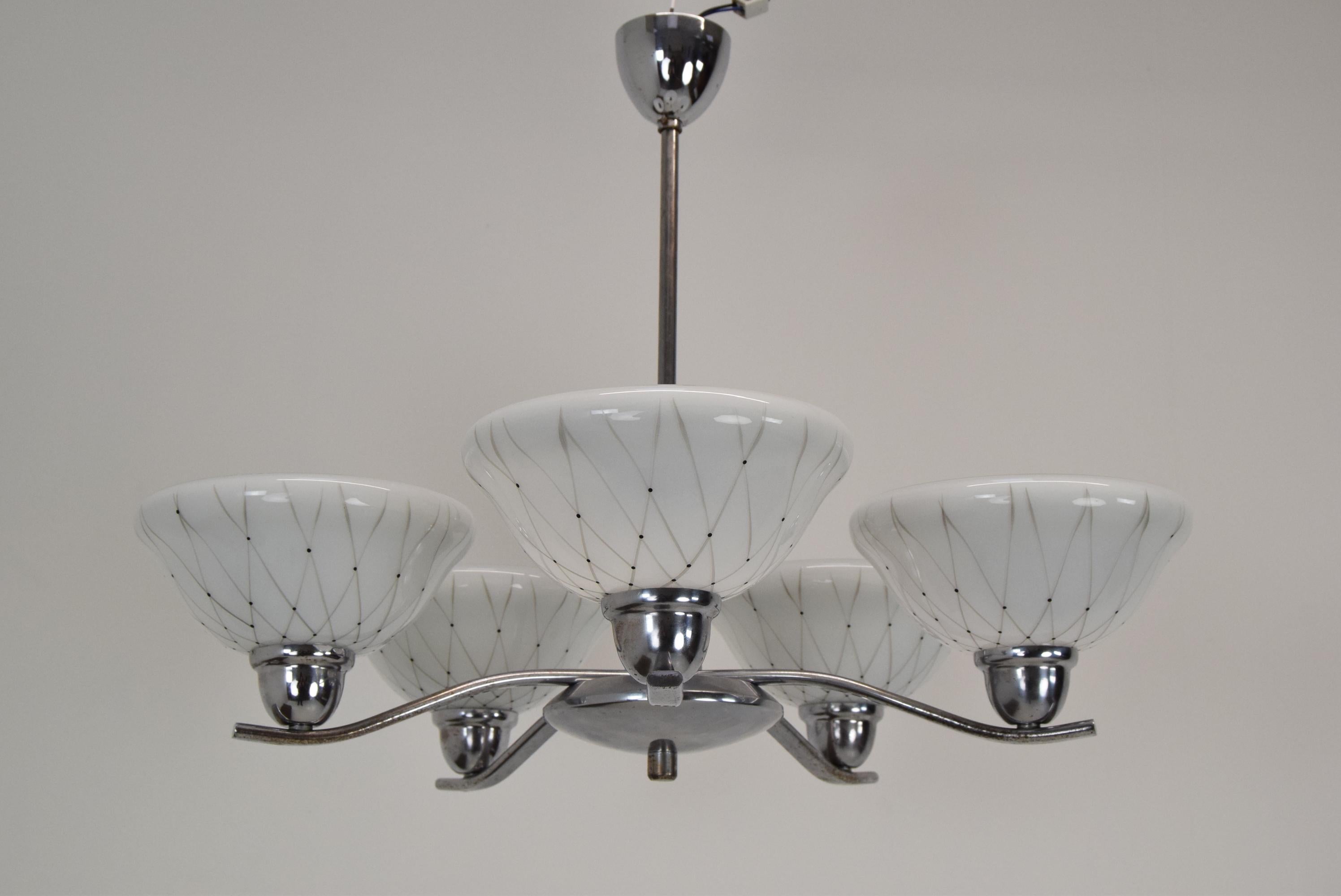 
Made in Czechoslovakia
Made of Glass,Metal,Chrome
The chandelier was completely dasassembled and cleaned
Fitted with new wiring
With aged patina
(One lampshade has a small chip on the inside,but it is not visible from under the chandelier,see