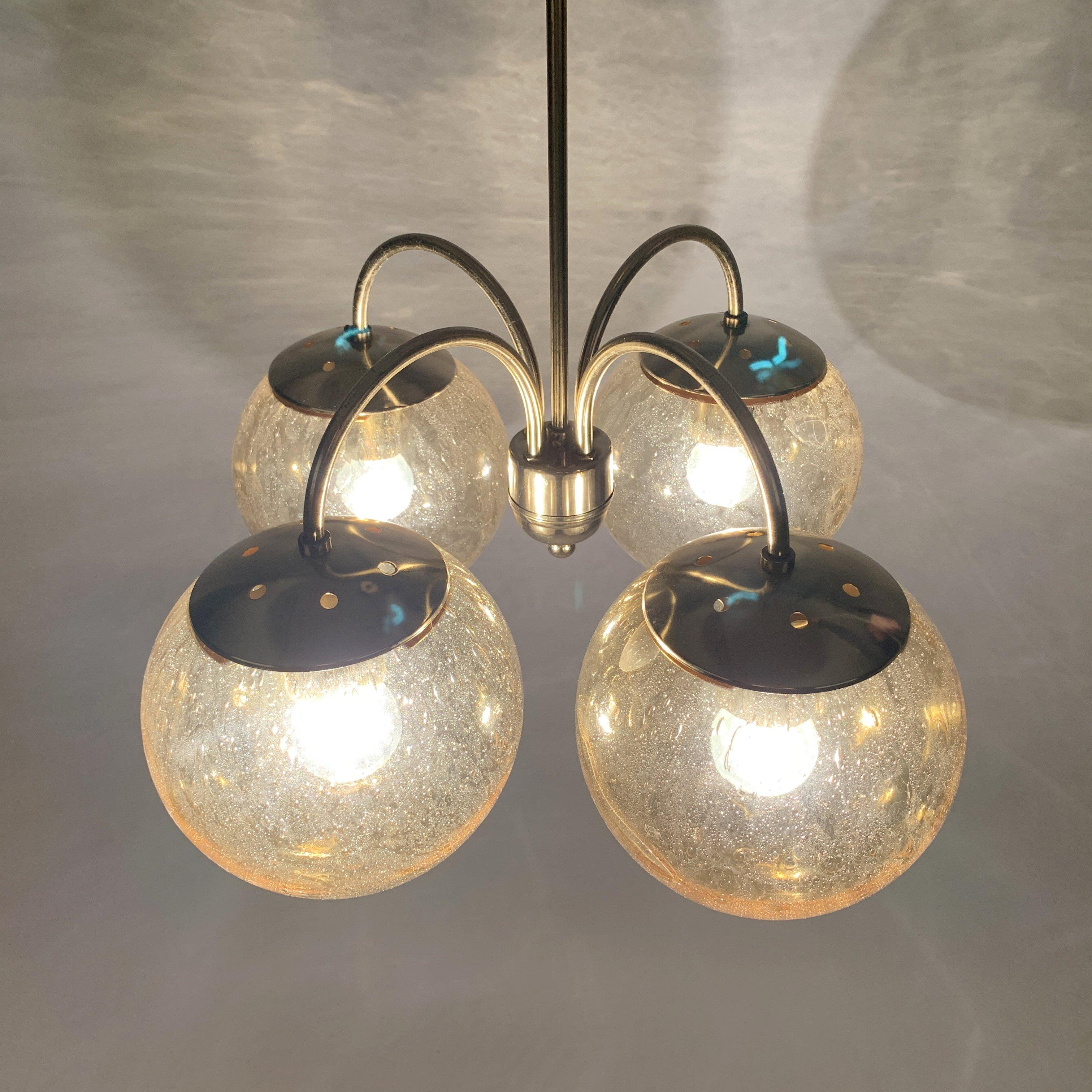 Beautiful midcentury chandelier made of glass and brass. Fully functional. Good original condition.
Bulbs: 4 x E27 or E26.
