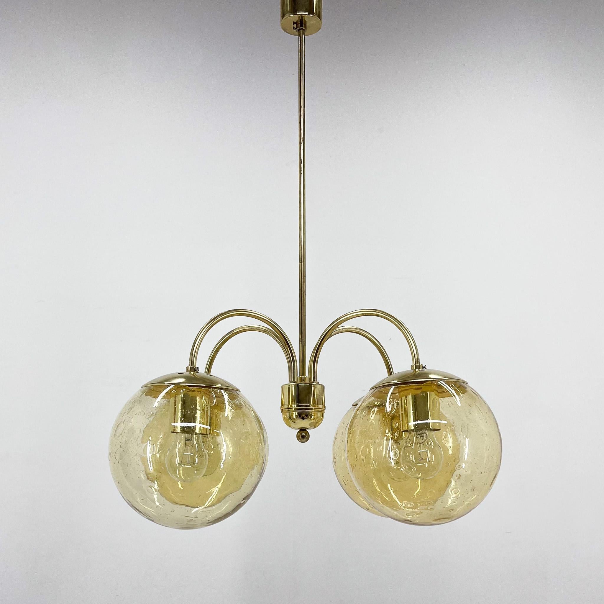 Beautiful mid-century chandelier made of glass and brass. Fully functional. 
Good original condition. 
Bulbs: 4 x E25 - E27.
