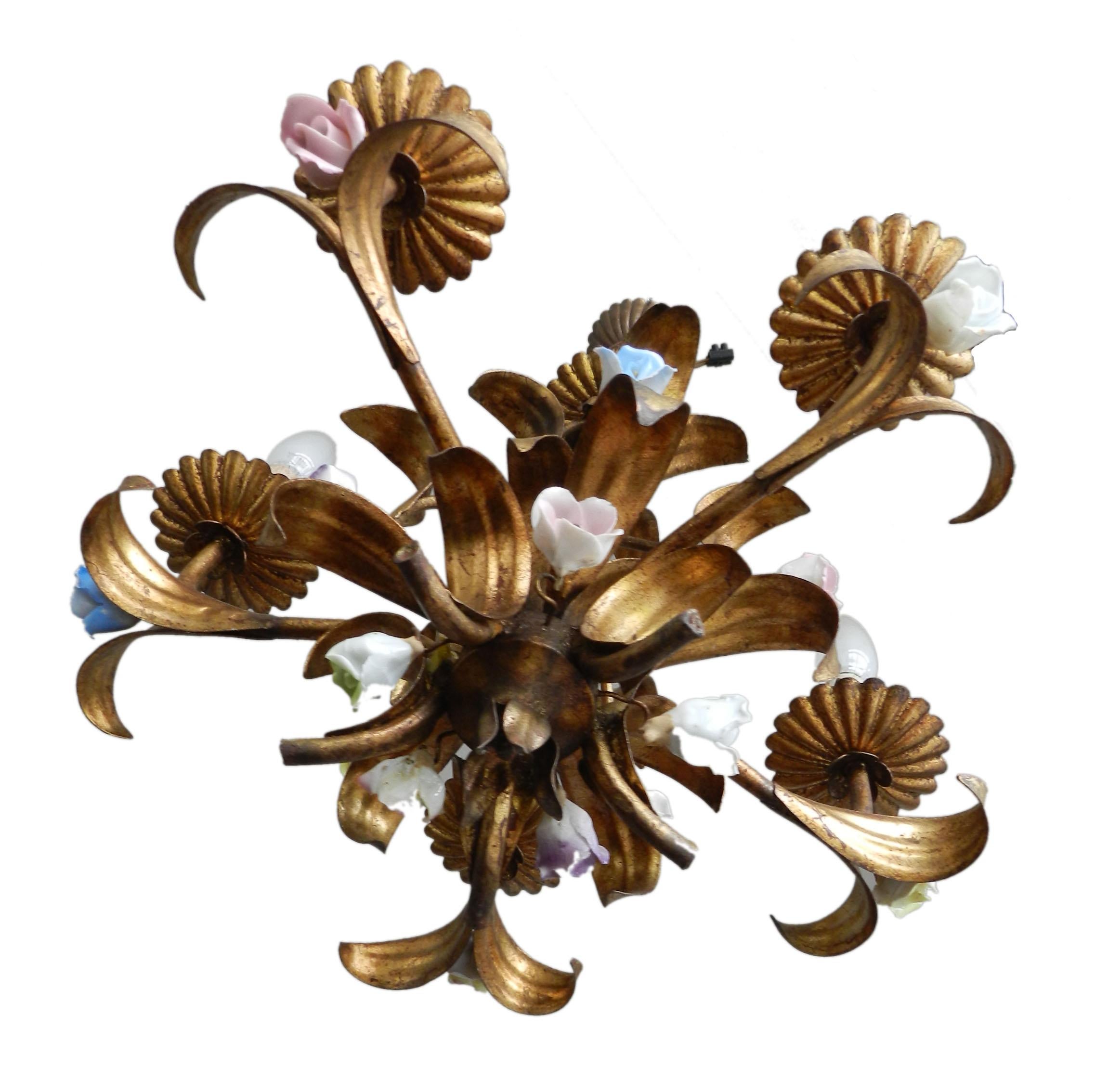 French Mid-Century toleware chandelier circa 1950
Gilded toleware five-light cage chandelier
It has small porcelain flowers interspersed in different colors
Drop 64 cm can be lengthened to give a longer drop if required please ask
In good