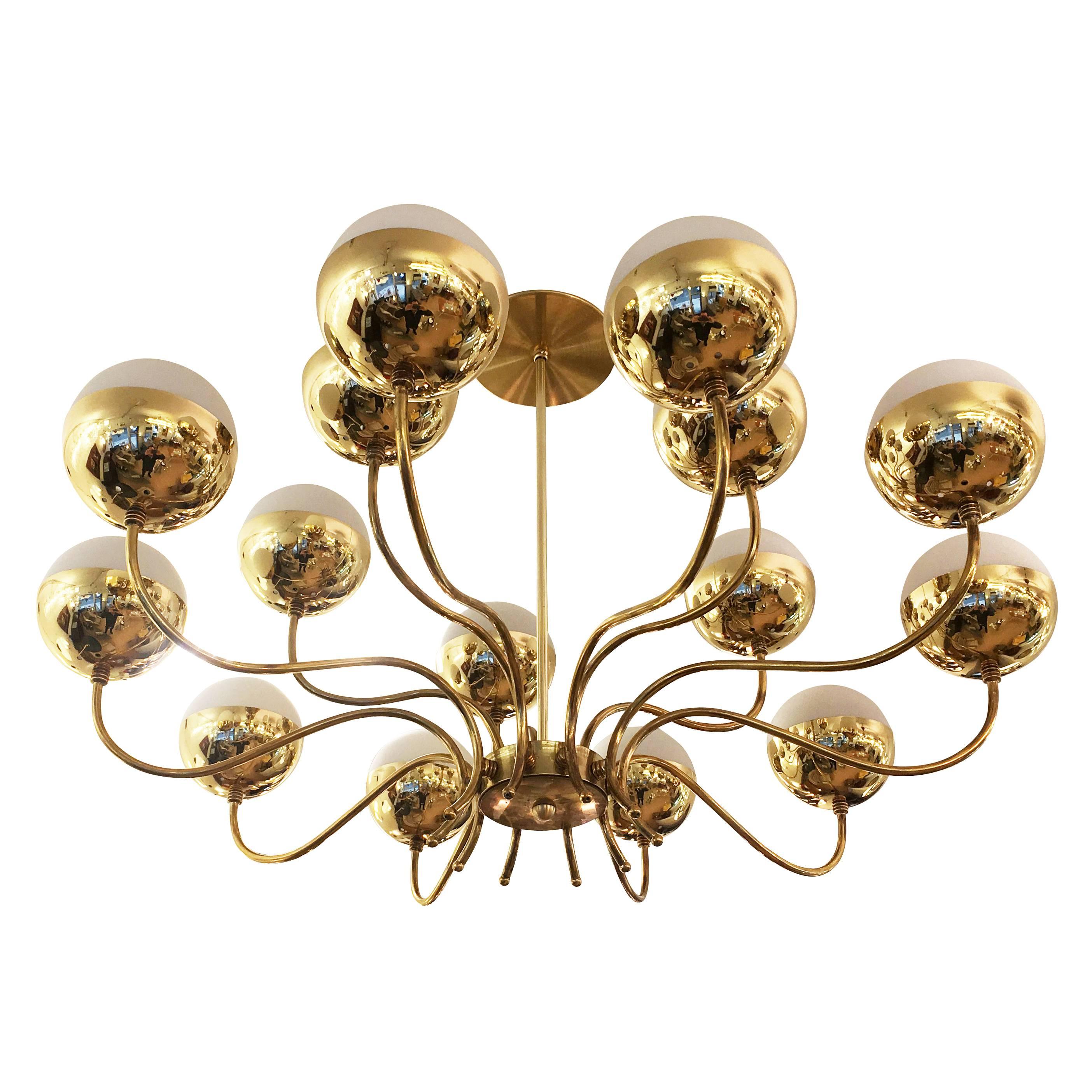 Fifteen-light chandelier in the manner of Stilnovo from the 1950s. The frame is all brass and the shades are frosted glass. Height of stem can be adjusted as needed.

Condition: Excellent vintage condition, minor wear consistent with age and use.