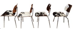 Ensemble de quatre chaises DCM Charles and Ray Eames du milieu du siècle dernier en cuir de vache d'origine