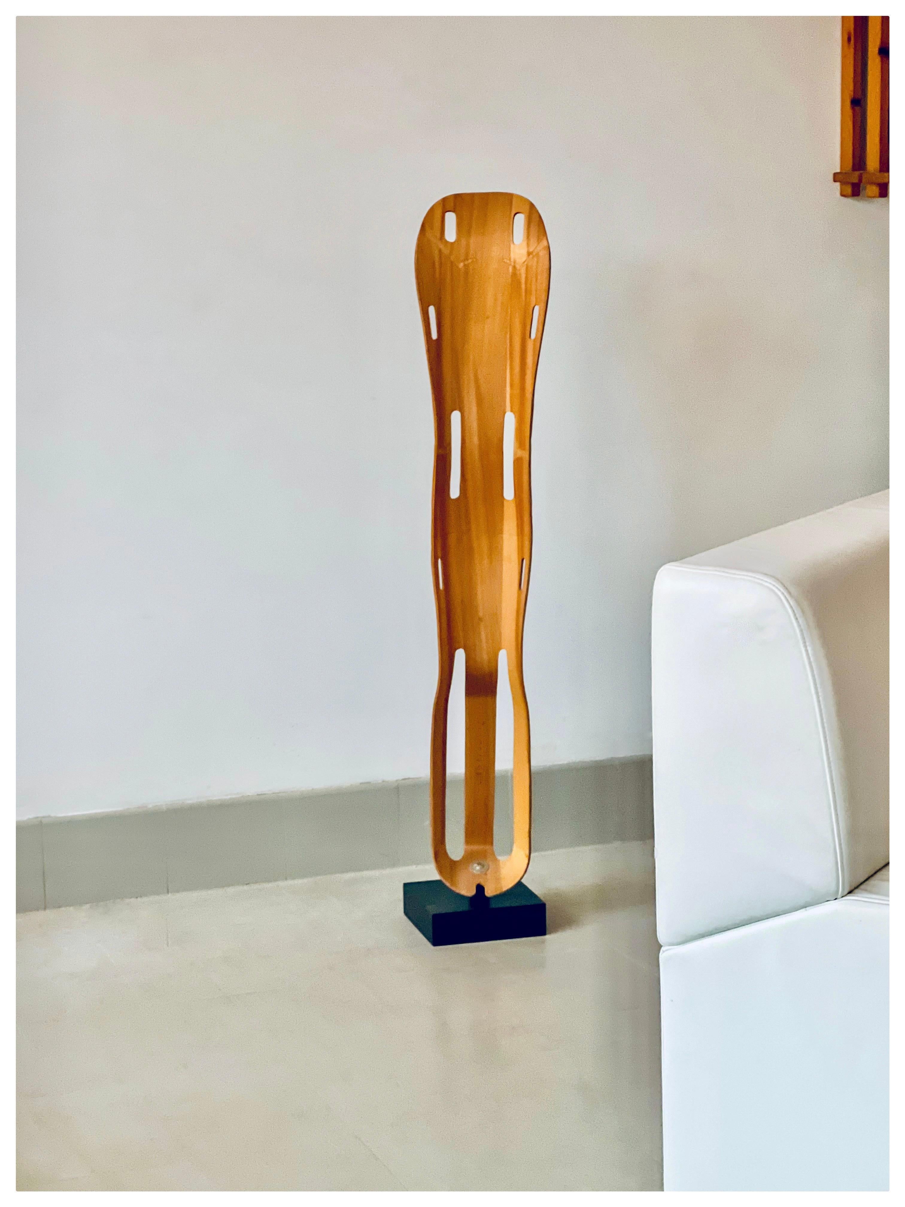 Before Charles & Ray Eames made their name with modernist chairs, they perfected the molding of plywood with a military leg splint for World War II. 
This iconic piece of history is sculpturally crafted in one piece using molded plywood and birch