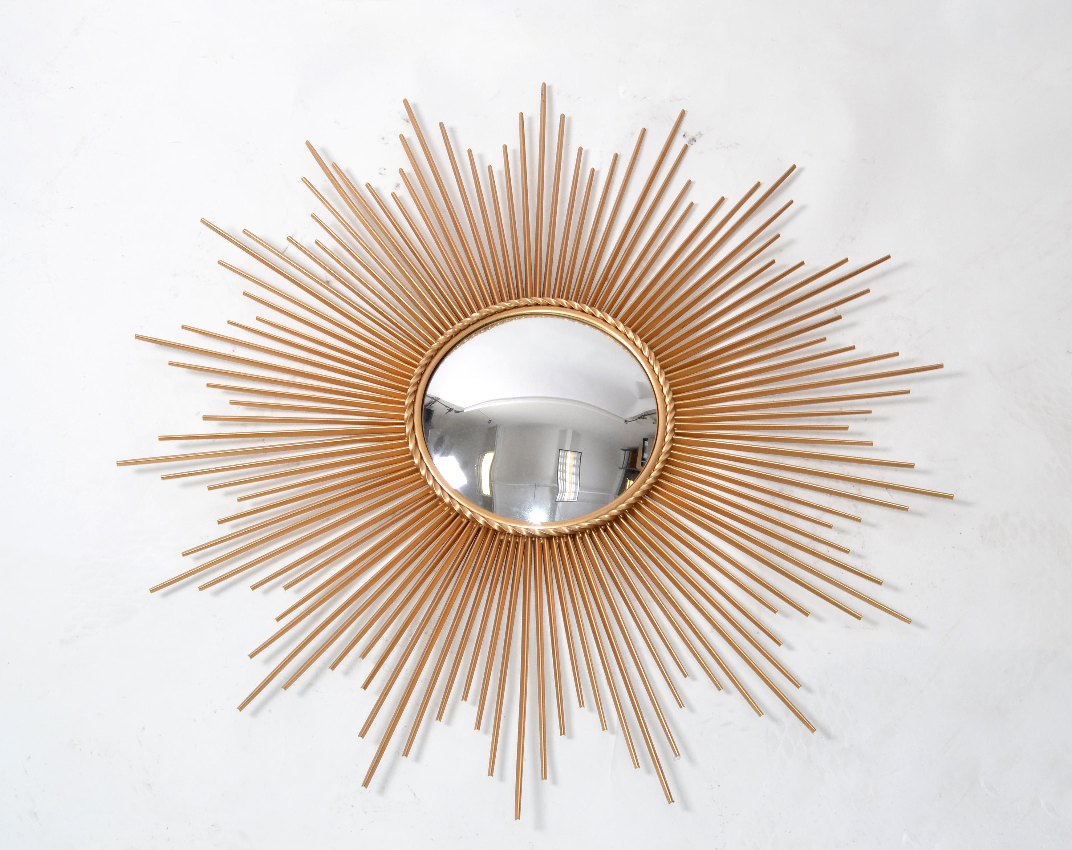 Chaty Vallauris style large 39.5 inches gilt metal sunburst wall mirror, wall art, wall sculpture with convex mirror.
Diameter of mirror is 10.5 inches.
Mid-Century Modern design ready for a new Home.
