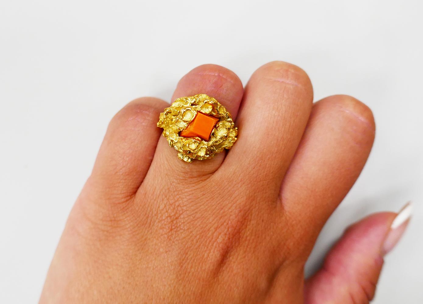 A unique Modernist ring by Chaumet, Paris made of 18 karat gold, featuring jade and coral (interchangeable). 

An abstract ring’s shape emphasizes the gold texture. The jade and coral are shaped as truncated cones. Their clean geometrical shape