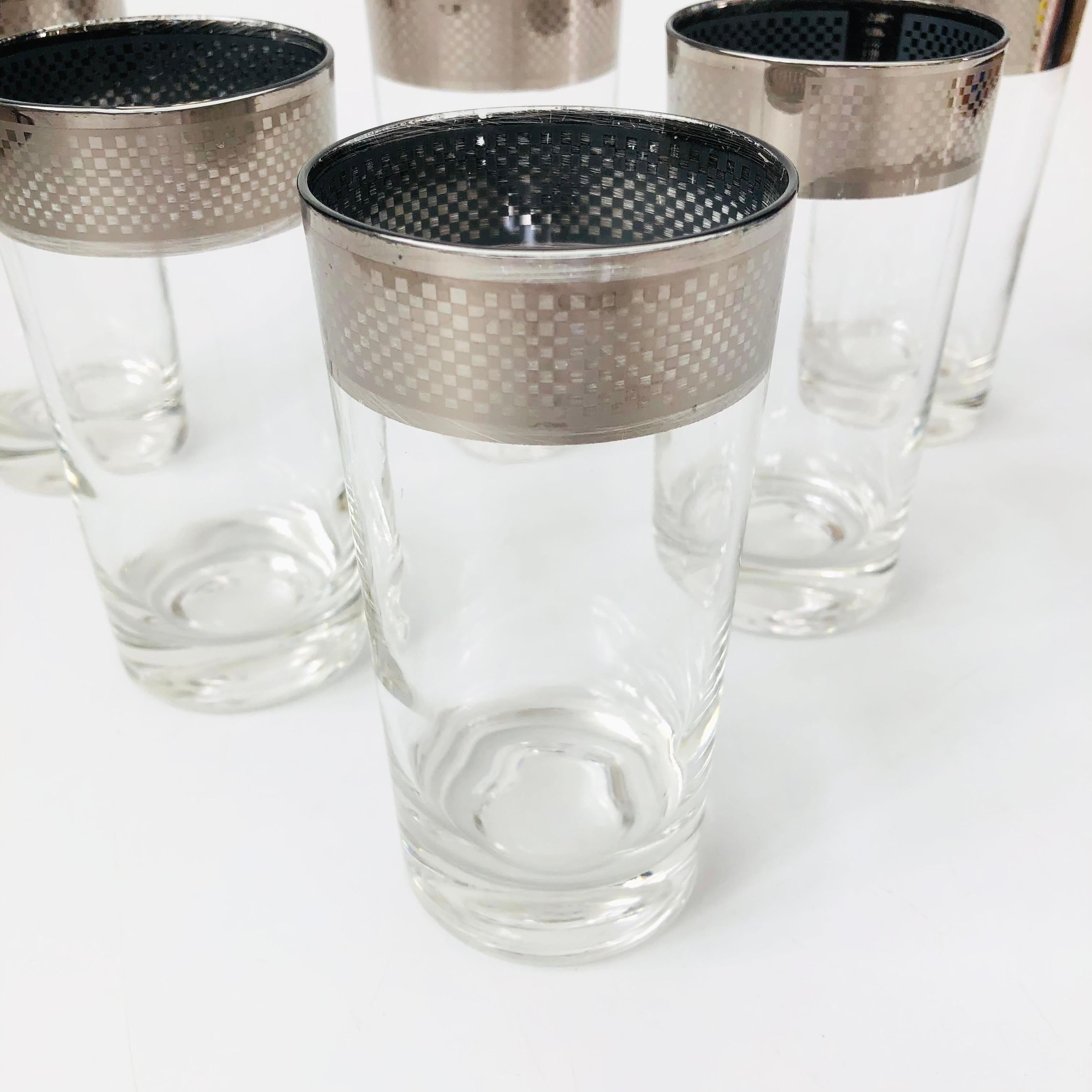 A beautiful set of 6 mid century silver rim tumblers. Unique checkered pattern to the silver rims. Perfect for using as water glasses or for cocktails.

