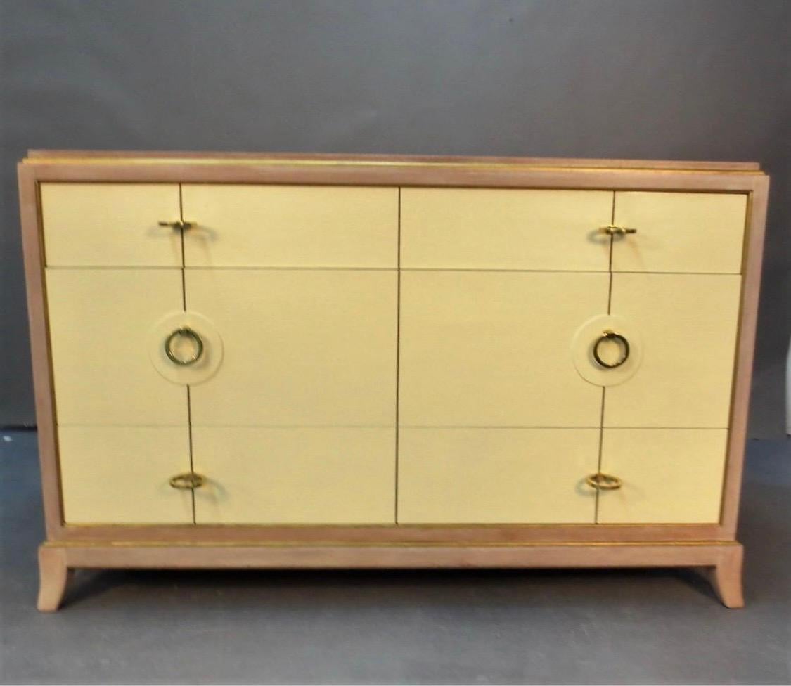 Chest features staggered brass hardware, a Parzinger staple as well as great lines. The piece has been
stained a pale white and the drawer fronts are painted pale yellow. While there is no Parzinger hallmarks
we believe this is an early (circa