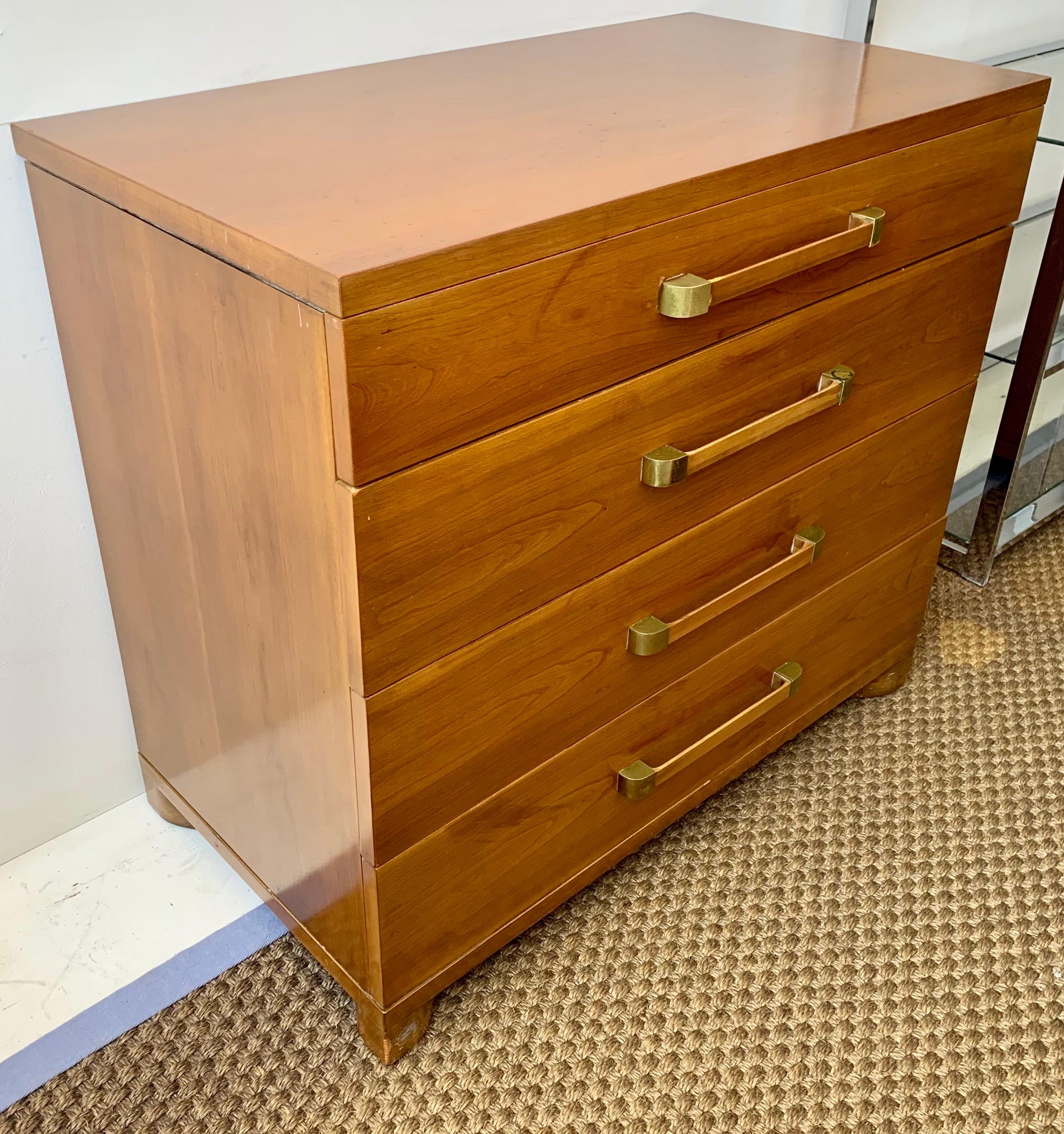 John Widdicomb four drawer chest of drawers features clean, classic mid-century lines. Exquisite walnut case construction in the original saffron finish. Exceptional craftsmanship and quality.