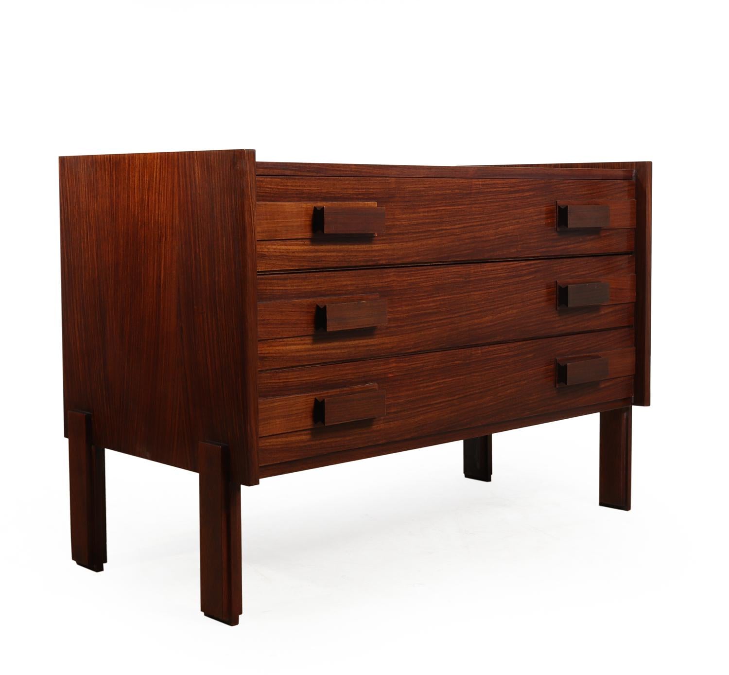 Midcentury chest of drawers, circa 1960
This original, midcentury chest of drawers is from the 1960s and is rosewood. The chest has solid handles, three drawers, dovetail joint construction and has been fully restored and polished to be in