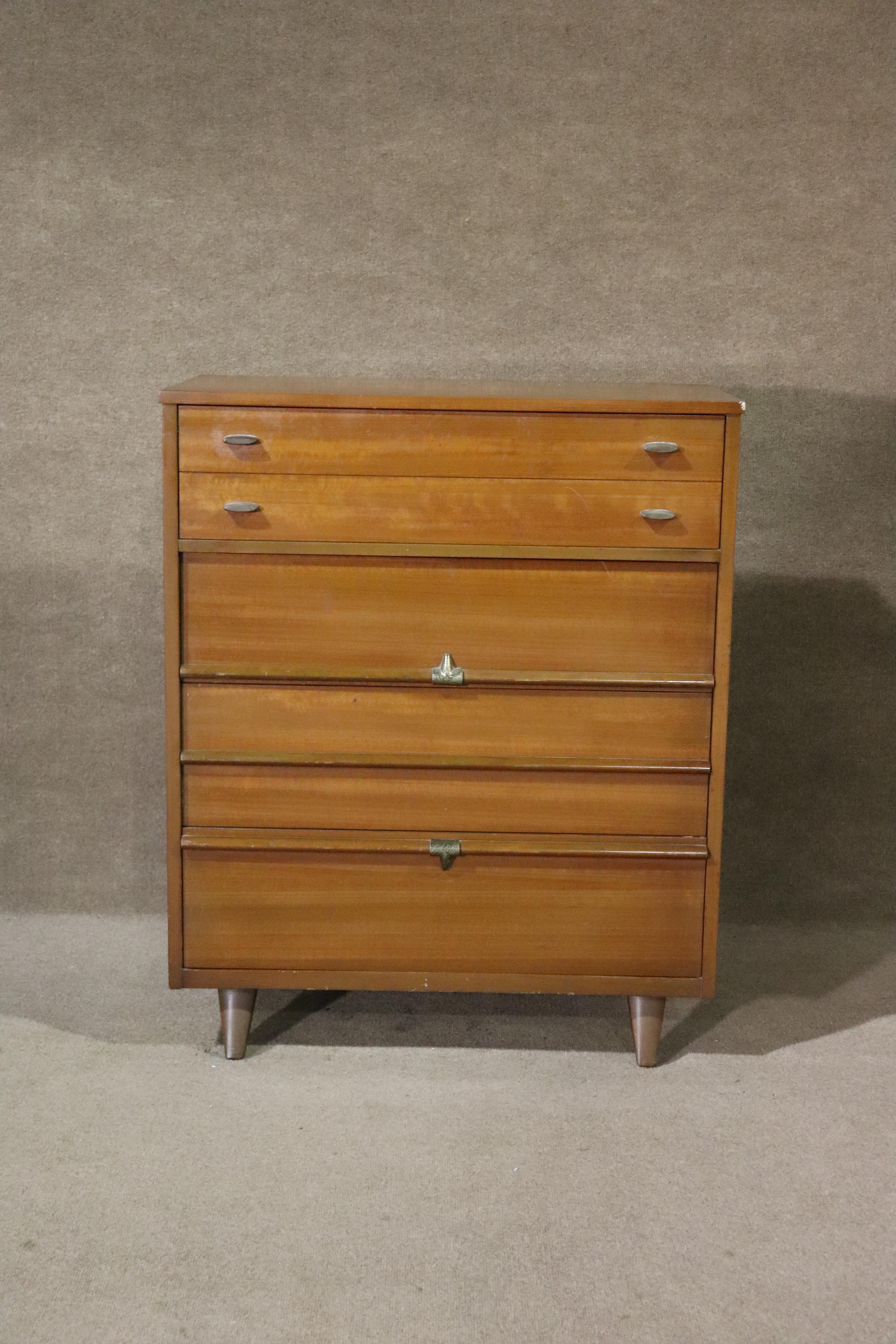 Tall mid-century modern American made dresser with four deep drawers. Walnut grain with metal hardware.
Please confirm location NY or NJ