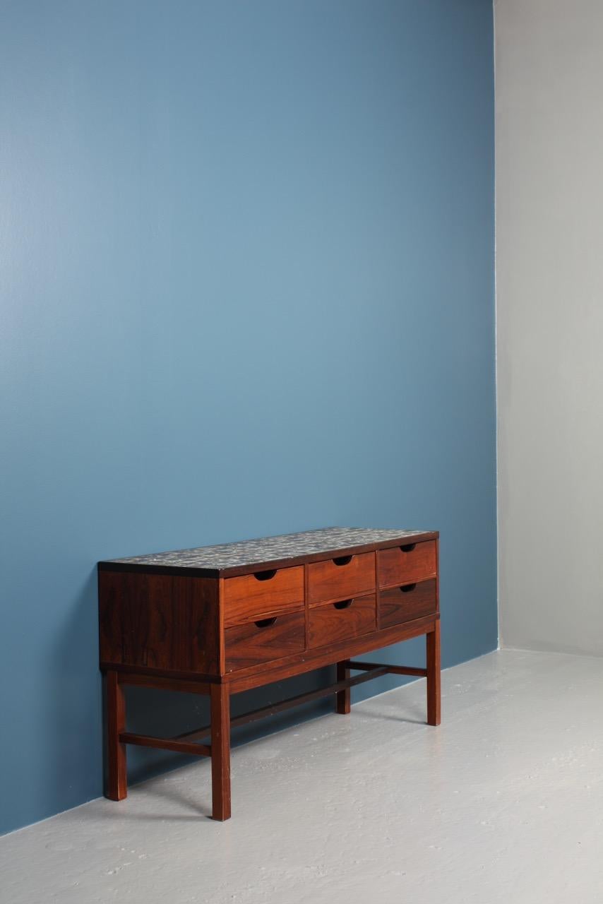 Chest of drawers in rosewood decorated with tiles by Royal Copenhagen. Designed by Severin Hansen and made by Haslev Furniture, Denmark. Great original condition, circa 1960.