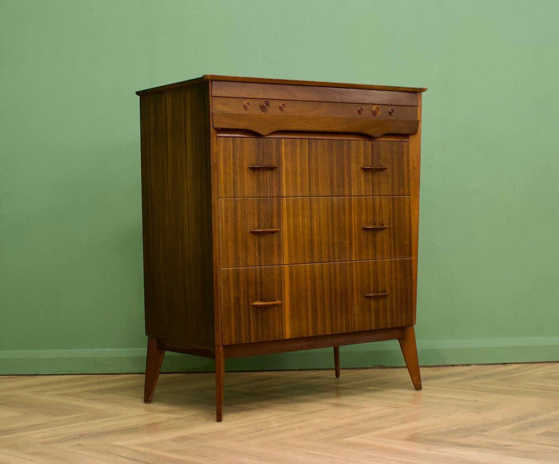 A walnut chest of drawers from Waring an Gillow, circa 1950s
They were possibly one of the last pieces of furniture off the Lancaster factory's production line -  before the company were taken over and the factory closed
The top drawer features a