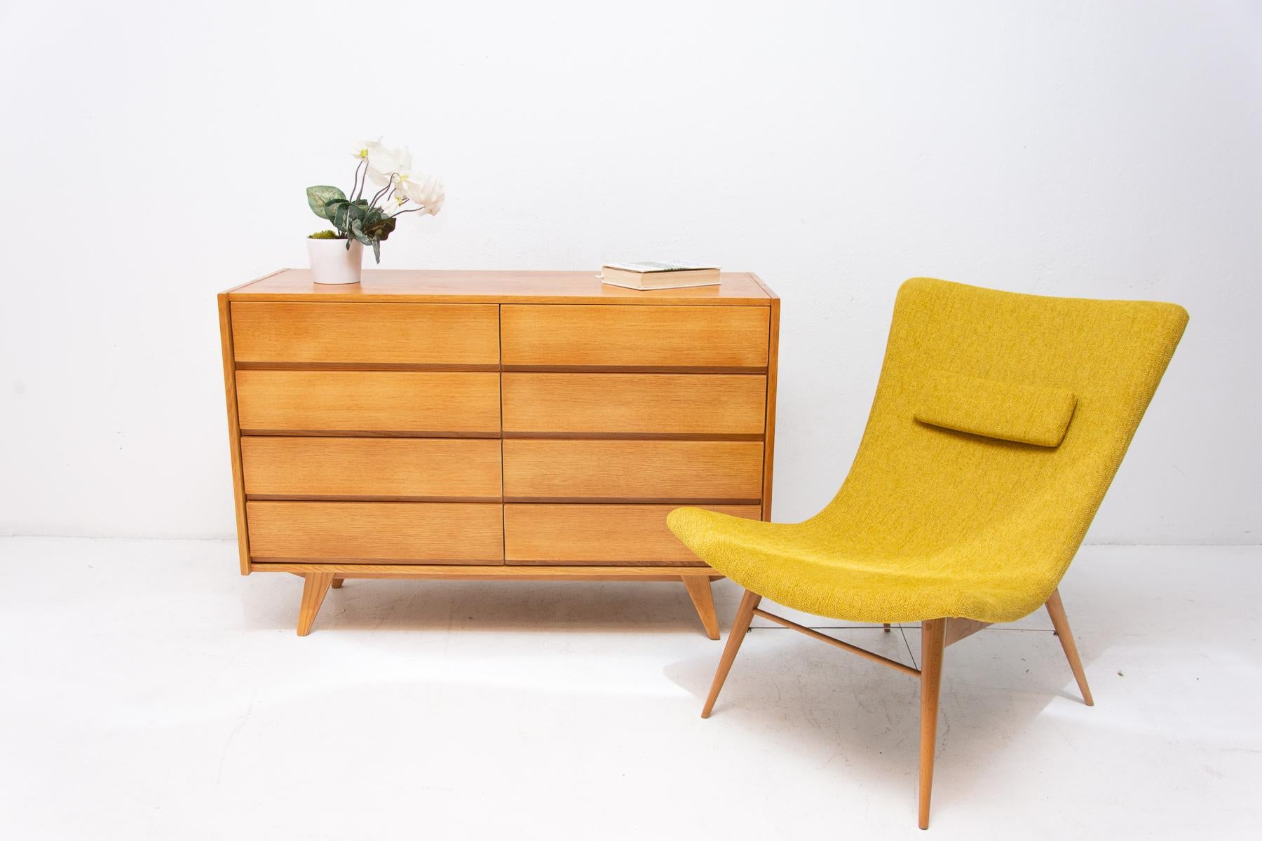 Midcentury chest of drawers, model no. U-453, designed by Jirí Jiroutek for Interiér Praha. It was made in the former Czechoslovakia in the 1960s. This model is associated with the world-famous EXPO 58 in Brussels. It´s made of oakwood and plywood