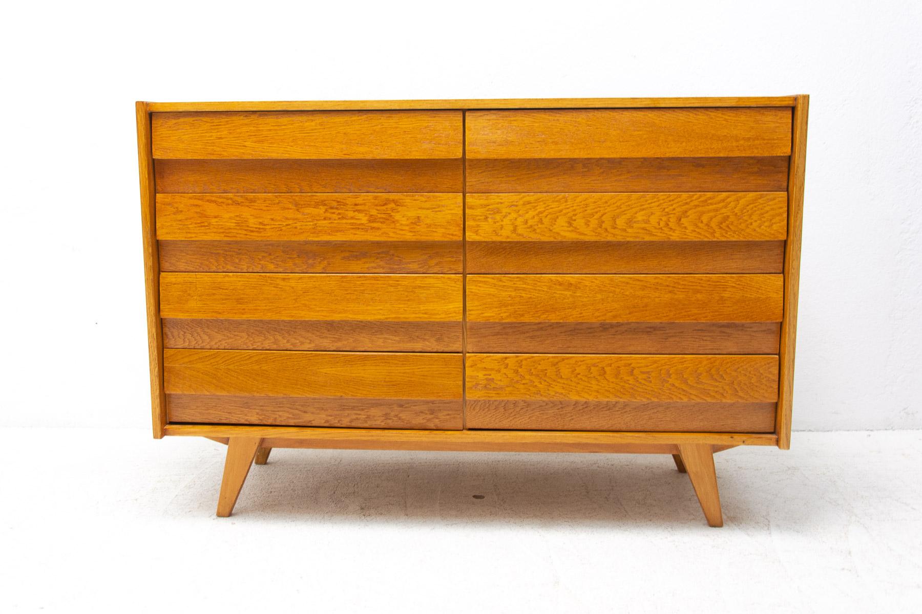 Mid century chest of drawers, model no. U-453, designed by Jirí Jiroutek for Interiér Praha. It was made in the former Czechoslovakia in the 1960´s. This model is associated with the world-famous EXPO 58 in Brussels. It´s made of oak wood and and