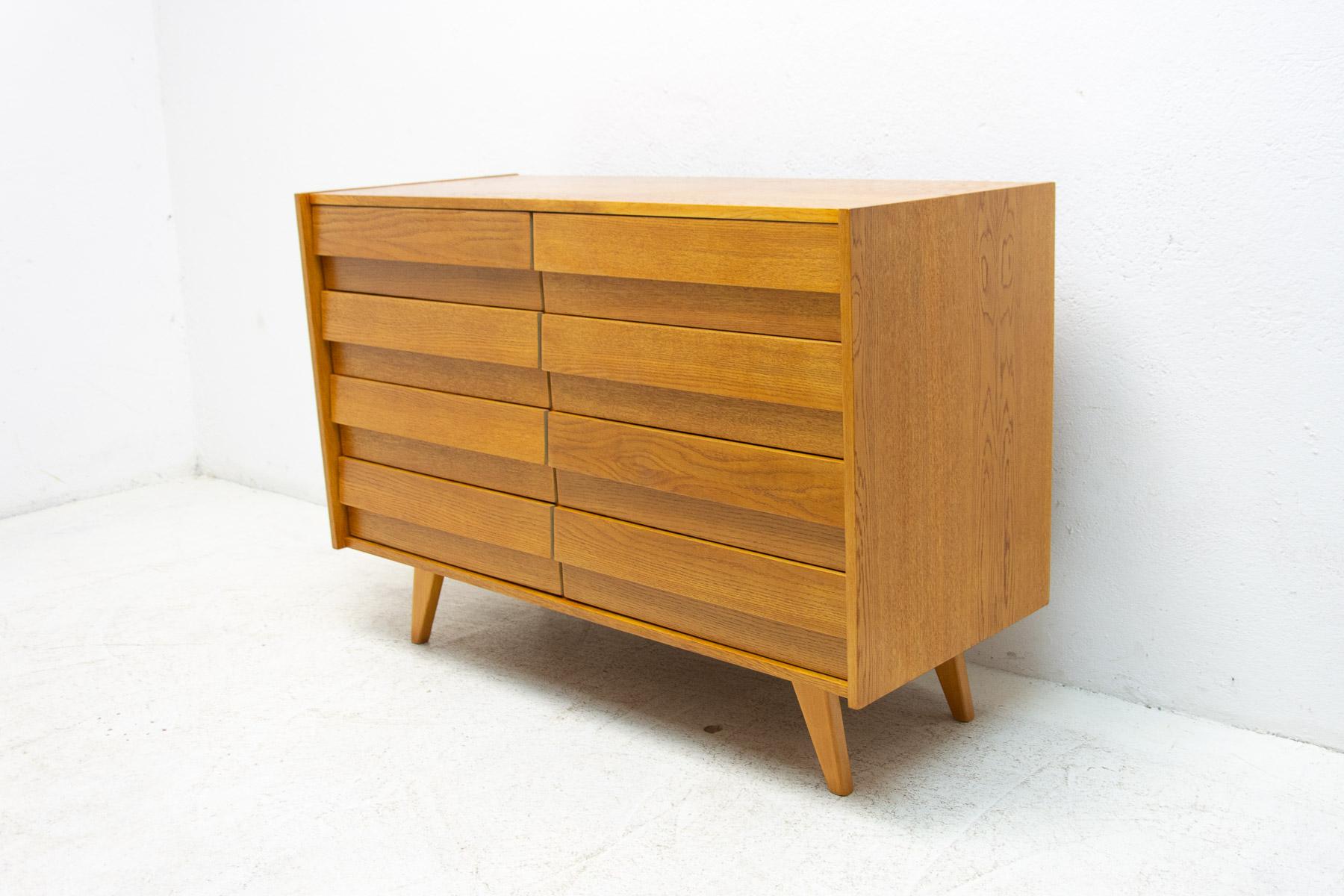 Mid century chest of drawers, model no. U-453, designed by Jiří Jiroutek for Interiér Praha. It was made in the former Czechoslovakia in the 1960´s. This model is associated with the world-famous EXPO 58 in Brussels. It´s made of oak wood and and