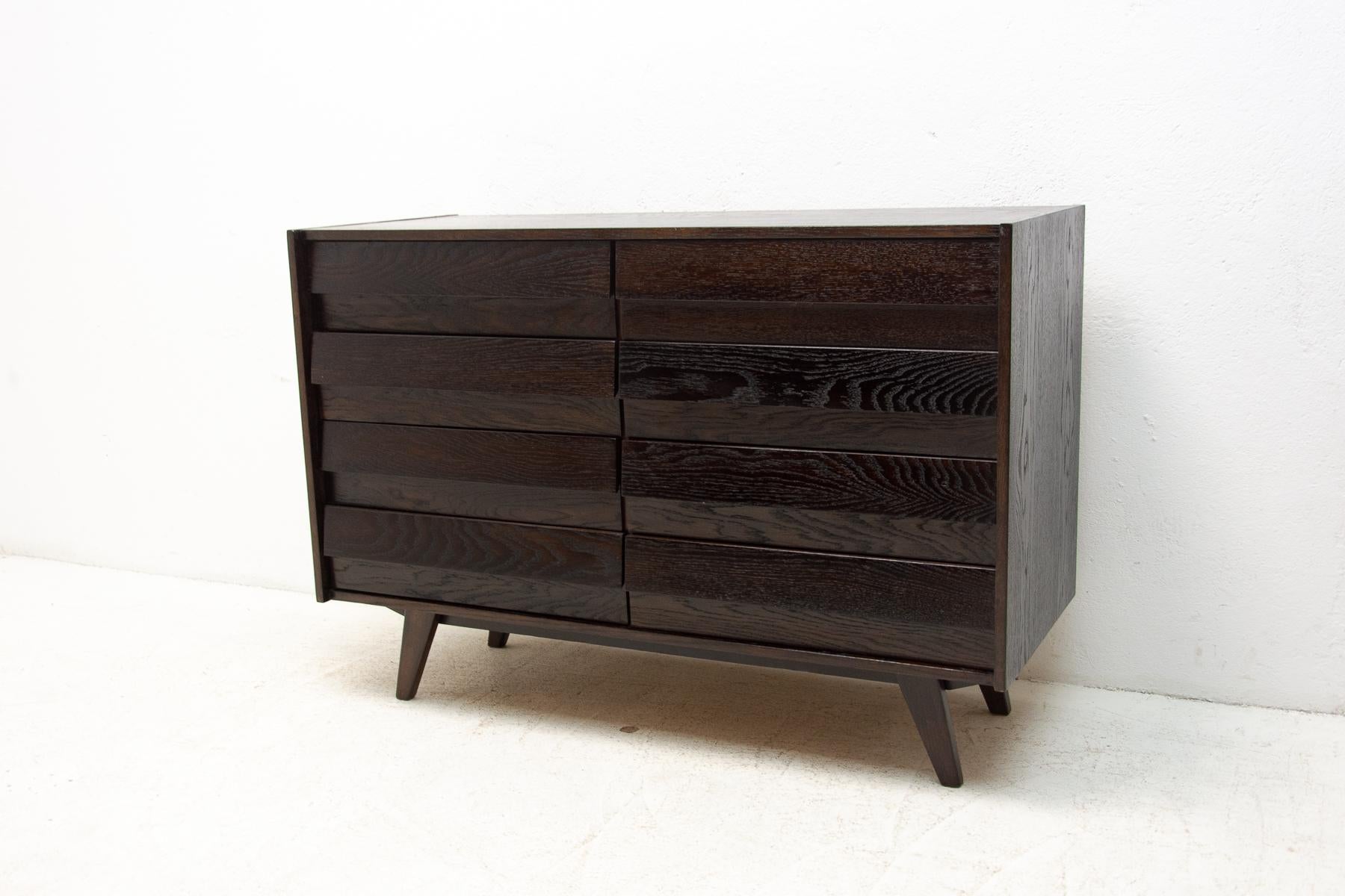 midcentury chest of drawers, model no. U-453, designed by Jirí Jiroutek for Interiér Praha. It was made in the former Czechoslovakia in the 1960´s. This model is associated with the world-famous EXPO 58 in Brussels. It´s made of oak wood and and