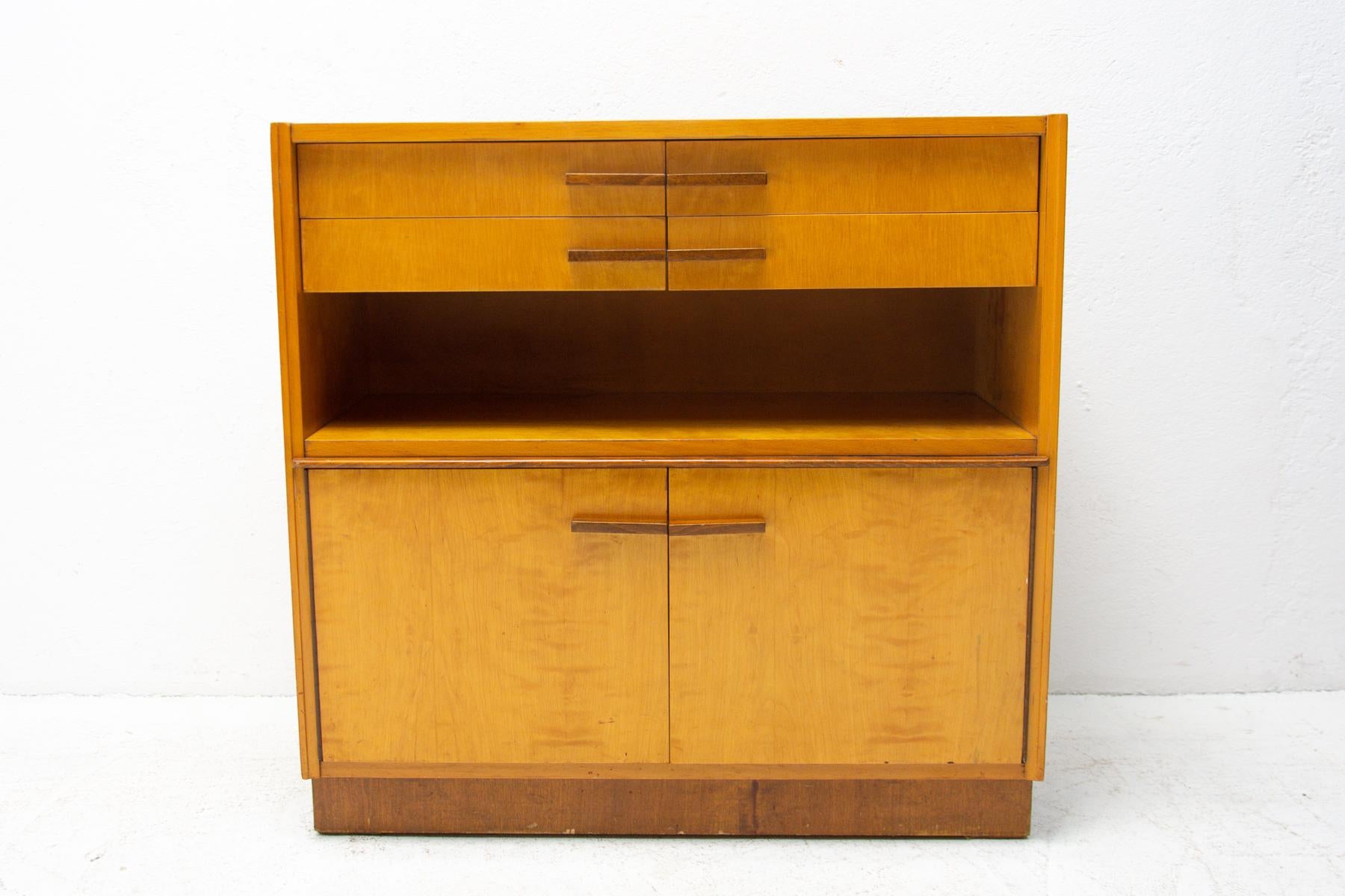 Multi-purpose glazed cabinet or chest of drawers, made for ÚP Závody in the 1960s. Made in a combination of ash, elm, maple, walnut, birch and poplar wood. It´s in good Vintage condition, shows signs of age and using.
 