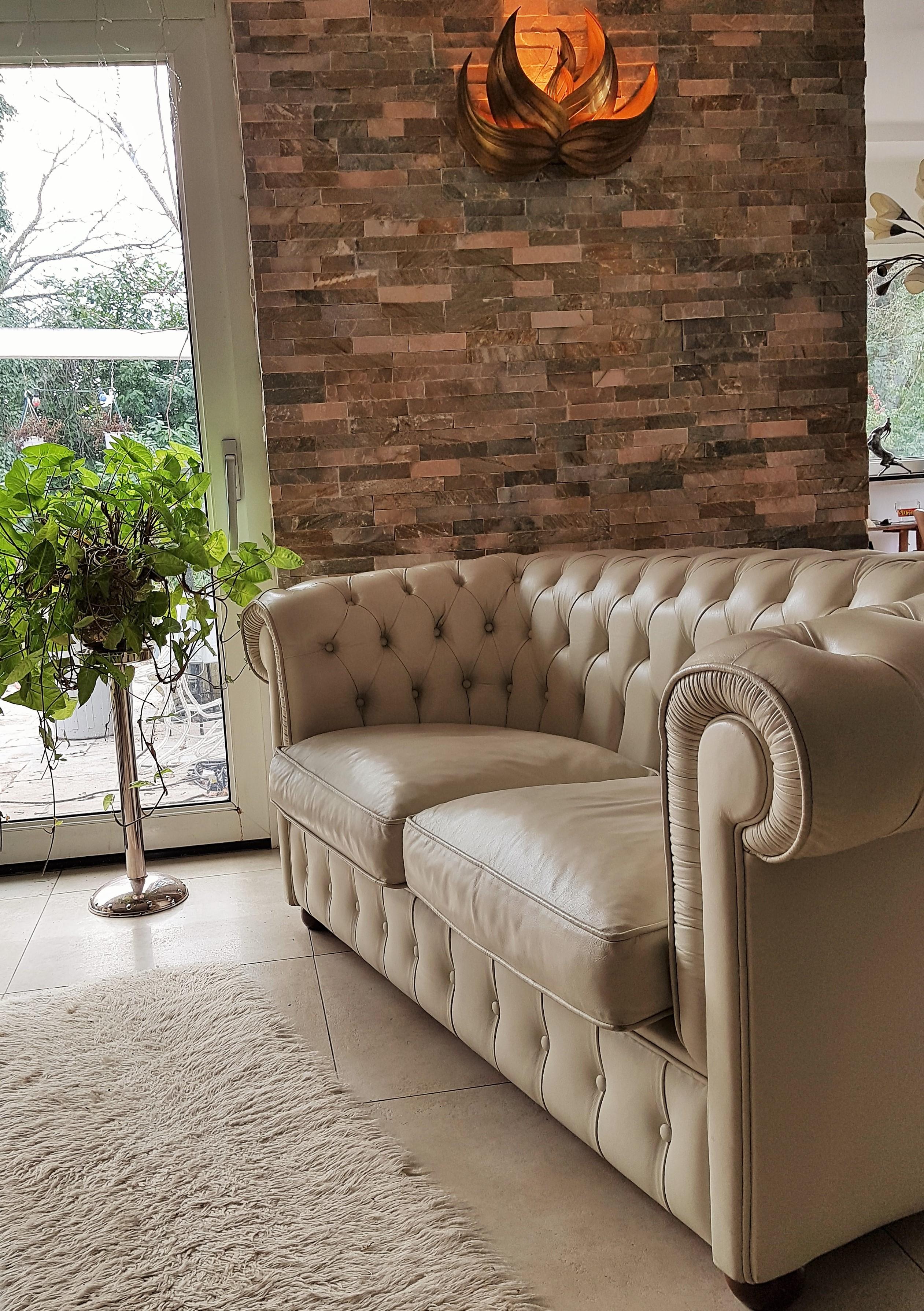 Chesterfield sofa loveseat, white leather, 2 seats. Very good vintage condition. White leather nice patinated, gently worn, no marks or scratches. Coming from fashion showroom, non-smoker!