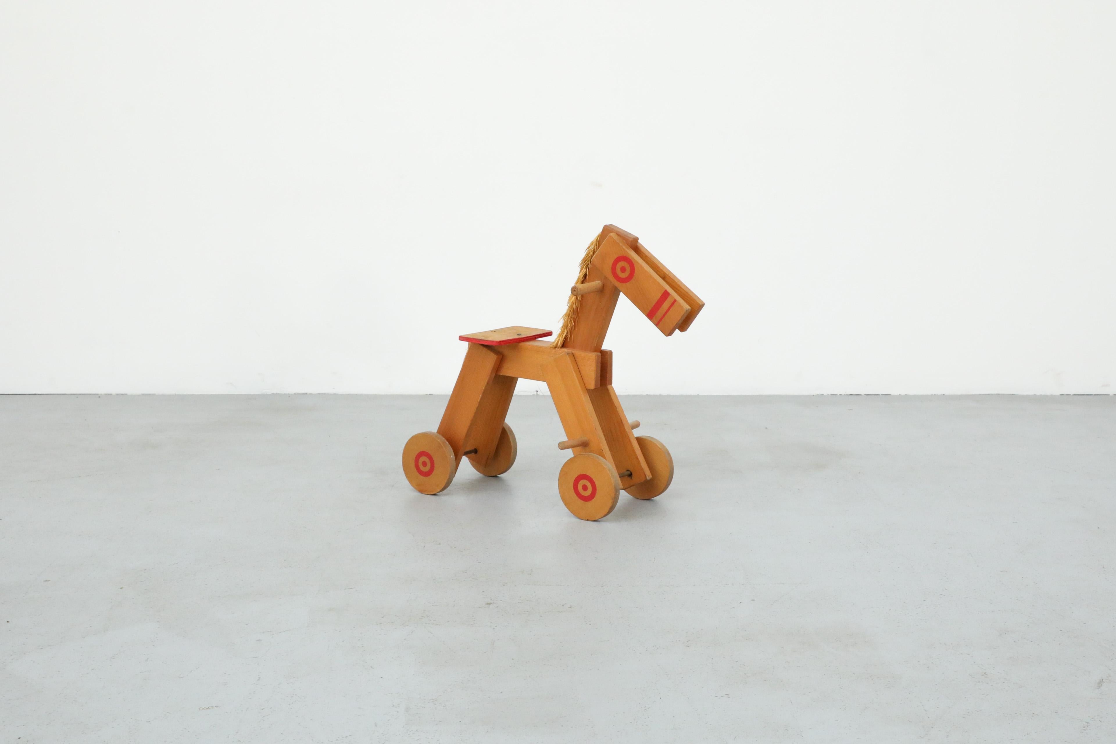 Mid-Century Modern Mid-Century Children's Wooden Pony with Wheels and Red Painted Details For Sale