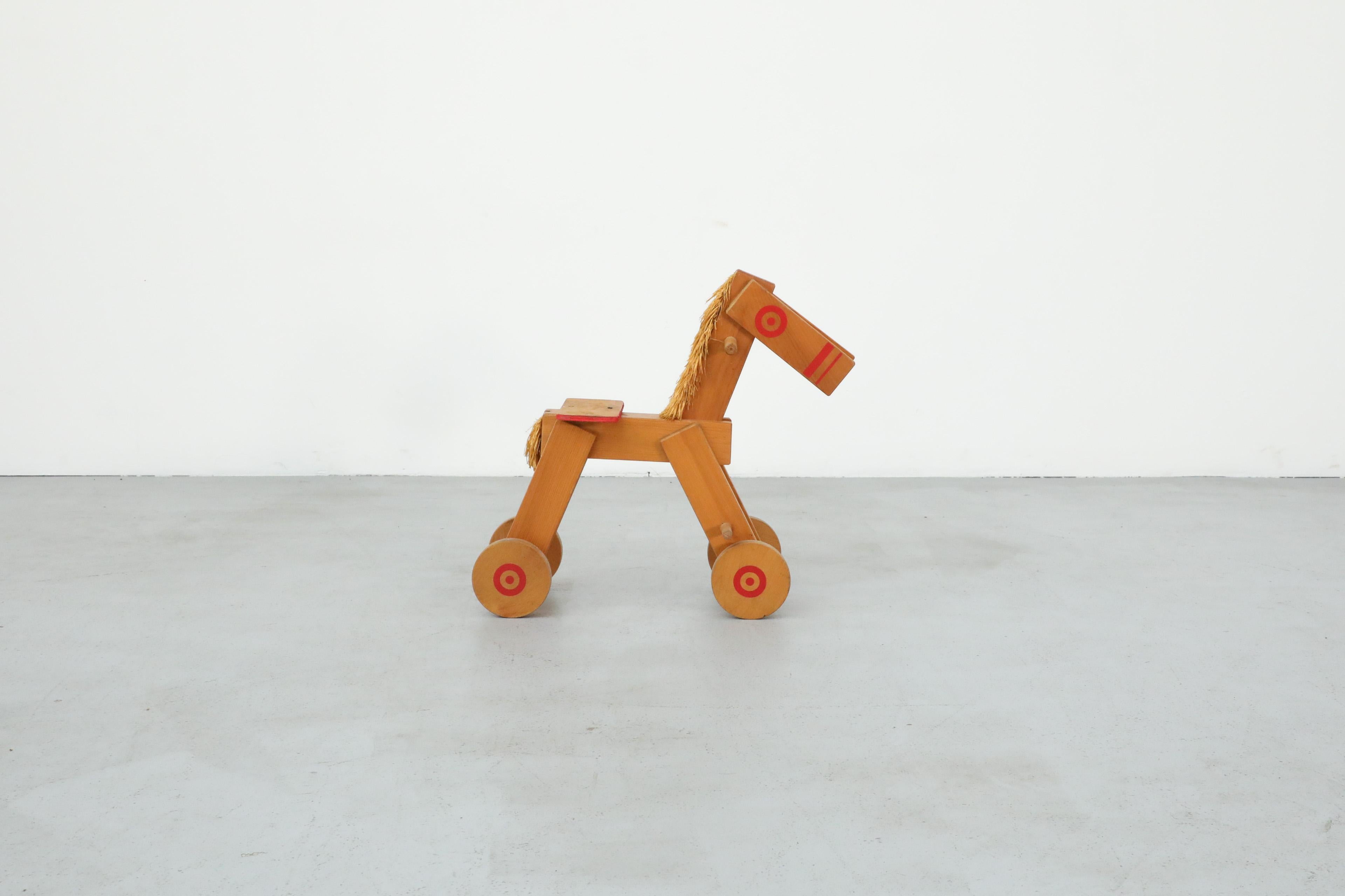 Dutch Mid-Century Children's Wooden Pony with Wheels and Red Painted Details For Sale
