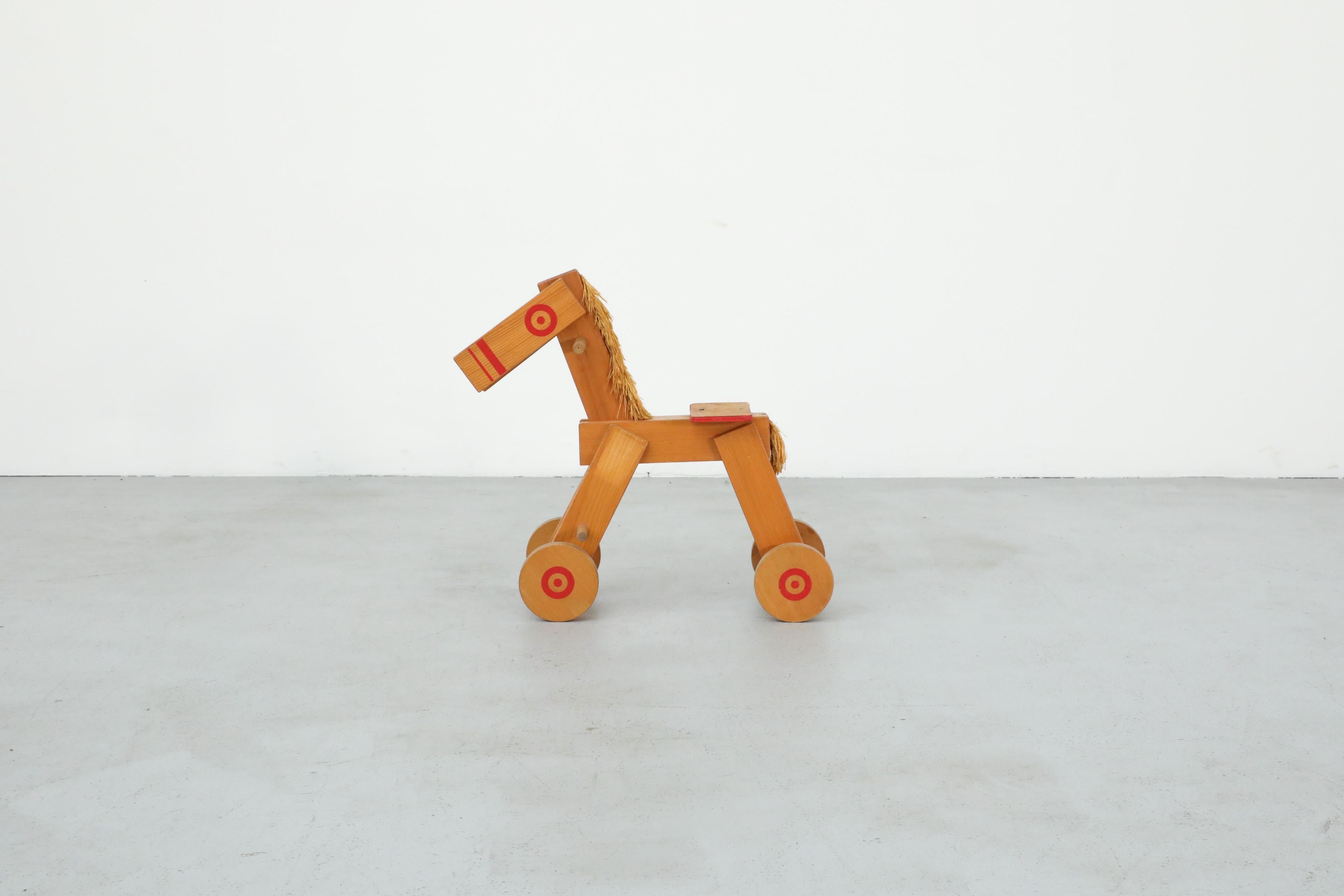 Mid-20th Century Mid-Century Children's Wooden Pony with Wheels and Red Painted Details For Sale