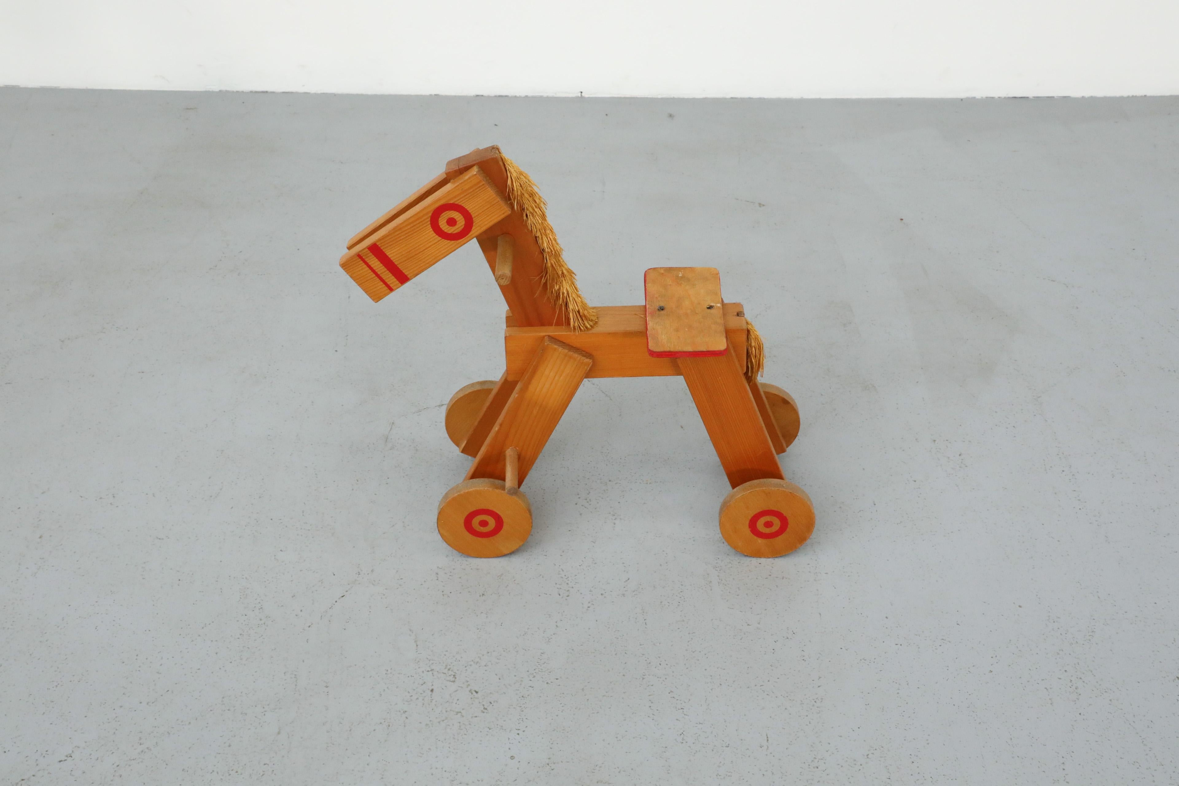 Straw Mid-Century Children's Wooden Pony with Wheels and Red Painted Details For Sale