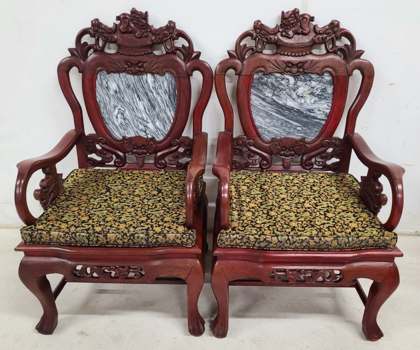 Offering One Of Our Recent Palm Beach Estate Fine Furniture Acquisitions Of A Pair of Mid Century Chinese Asian Rosewood & Marble Armchairs 

Featuring carved Foo Dogs and 2 custom cut seat cushions.
The marble back openings are actually the open