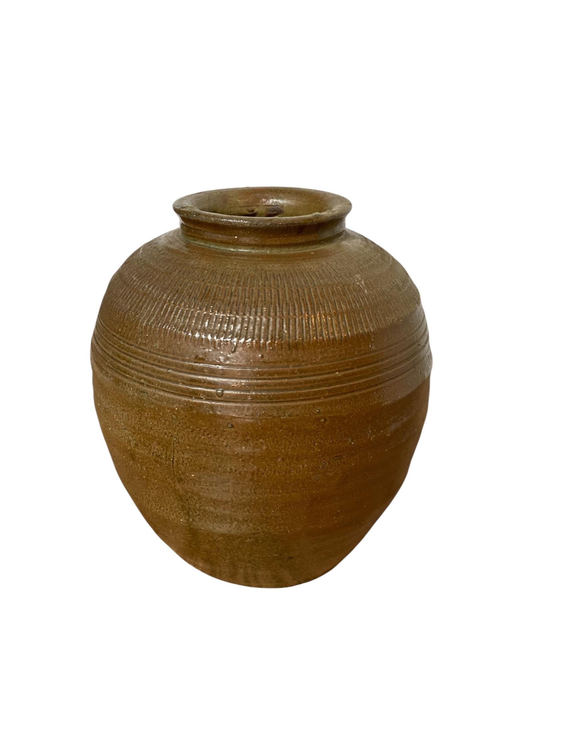 Mid Century Chinese Ceramic Pickling Jar Jade Green. Was once used for pickling foods. Jade green finish and outer surface that features a ribbed texture. Lovely example of Chinese pottery, with its imperfections and ageing over the years