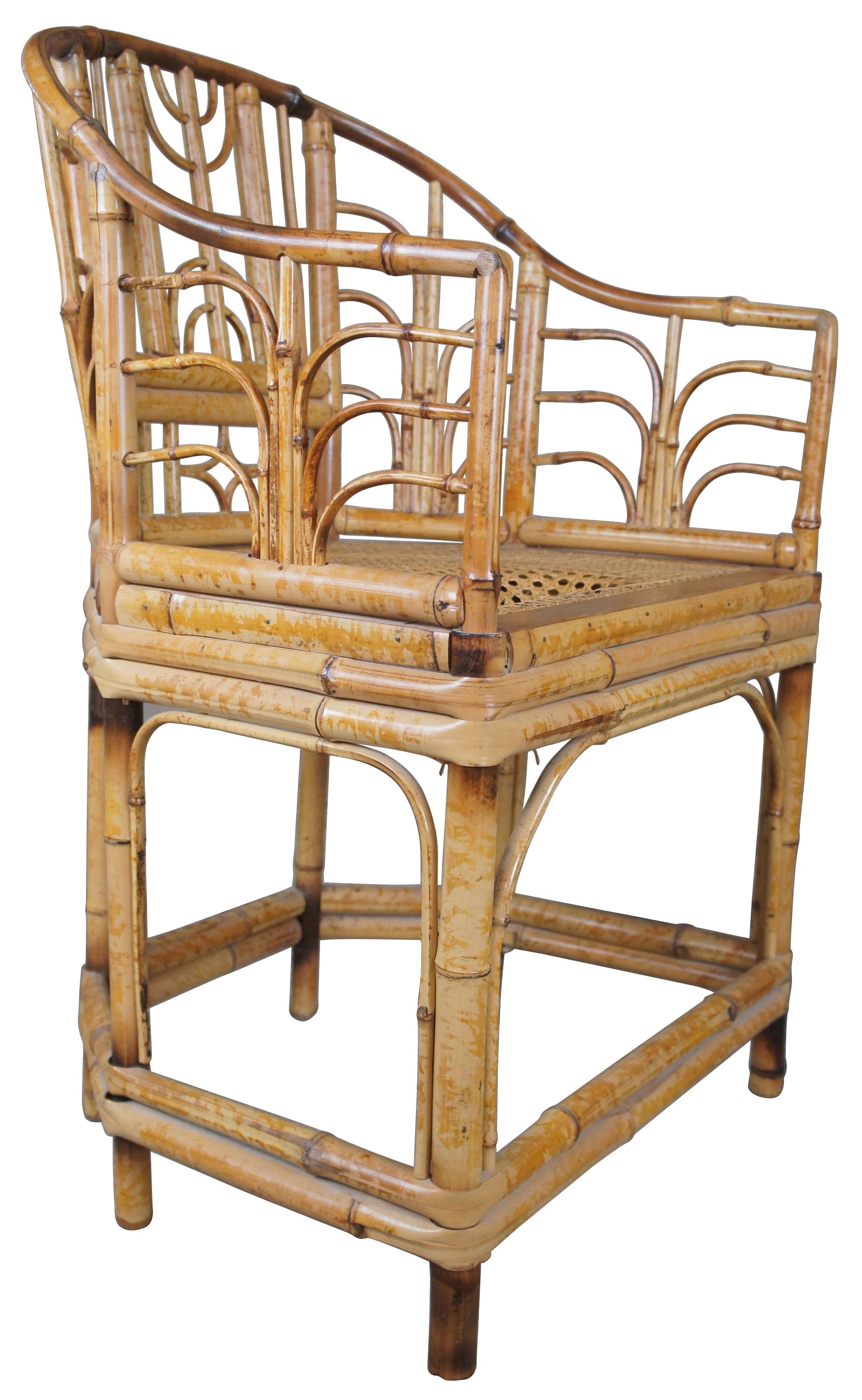 Chinese Chippendale style arm chair, circa 1960s. Made from bamboo with horseshoe back, bentwood design and caned seat.
 