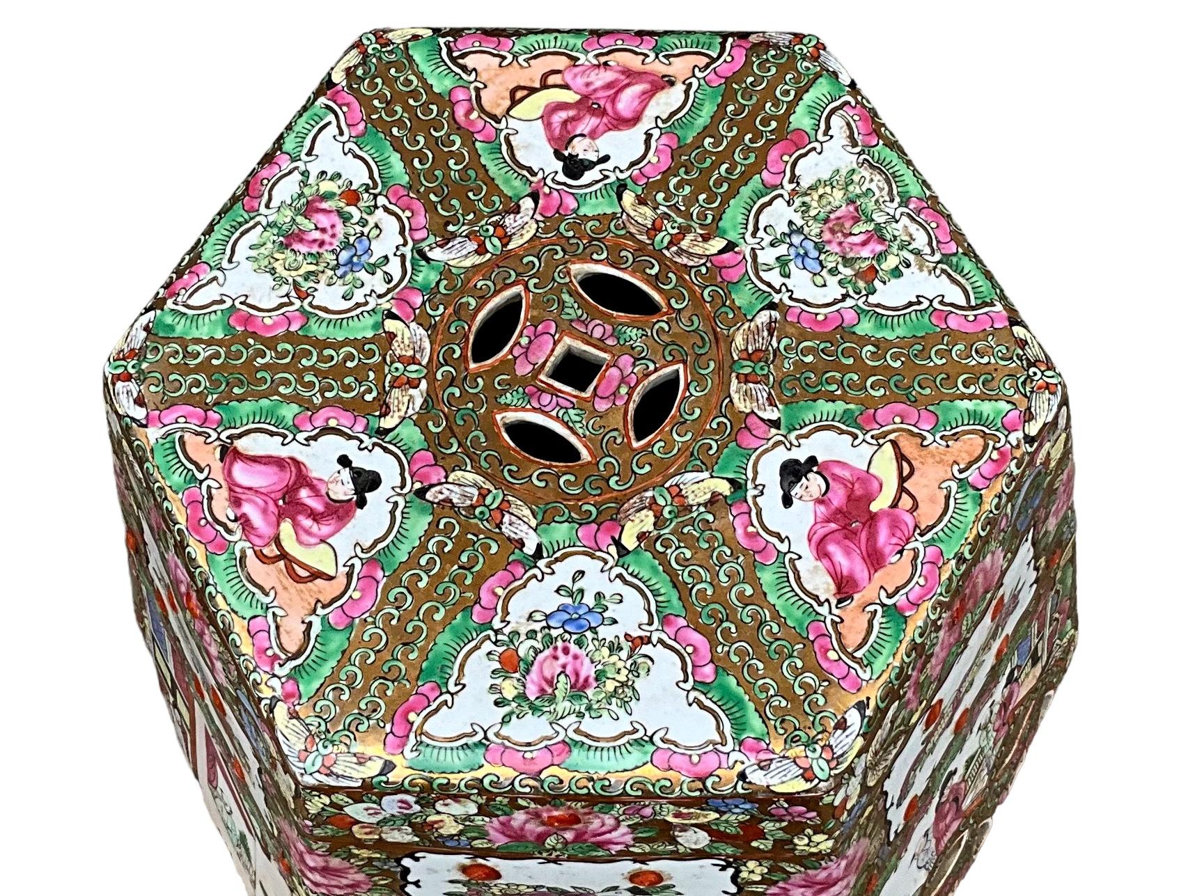 This is a mid-century Chinese Export style colorful famille rose garden seat or side table. It depicts Chinese pastoral scenes on each panel. The top is 10.5” in diameter.