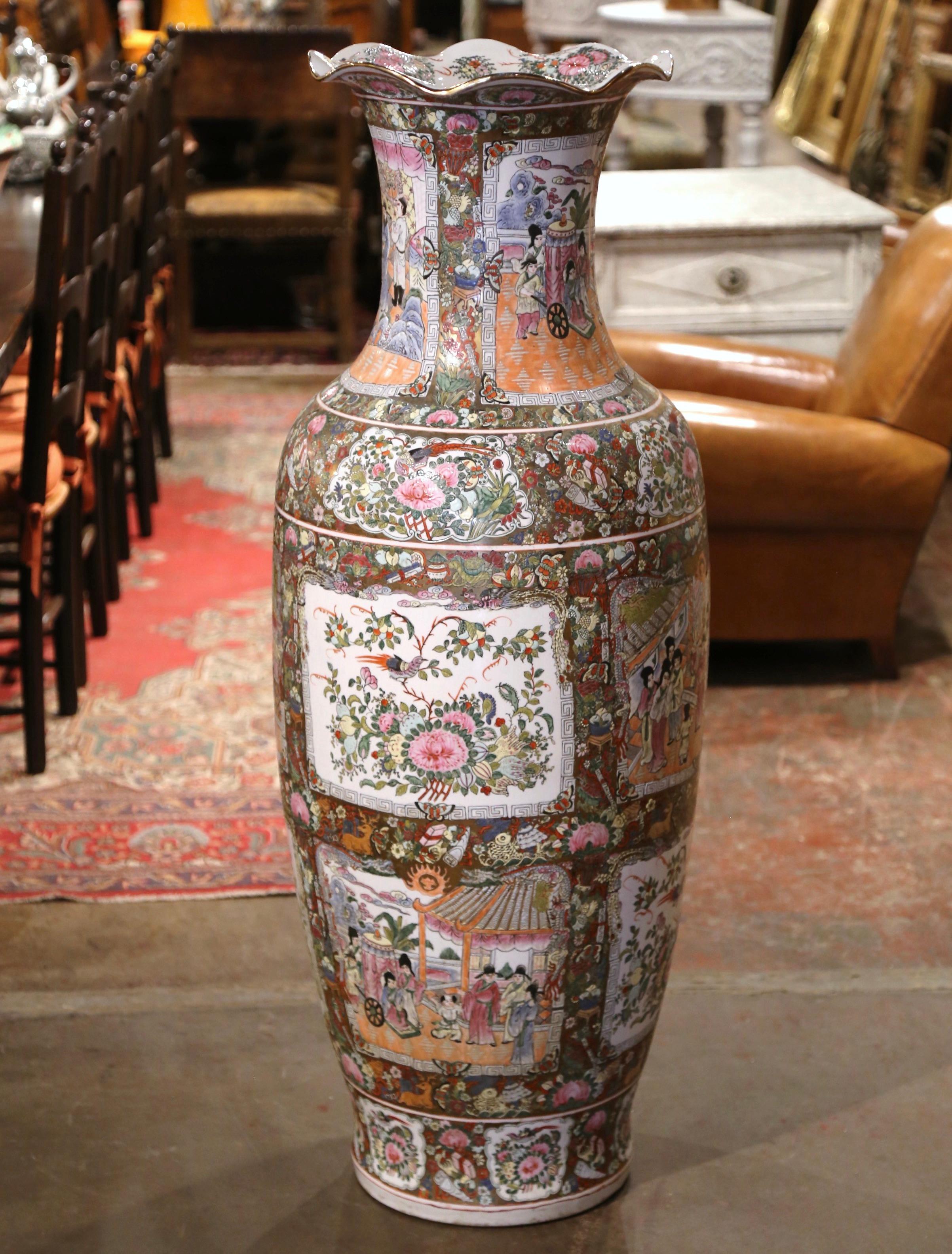 Decorate an entry or a room corner with this important colorful antique jar. Crafted in China circa 1950, the important Family Rose vase is round in shape decorated with a scalloped rim at the top. The tall vase is embellished with hand painted