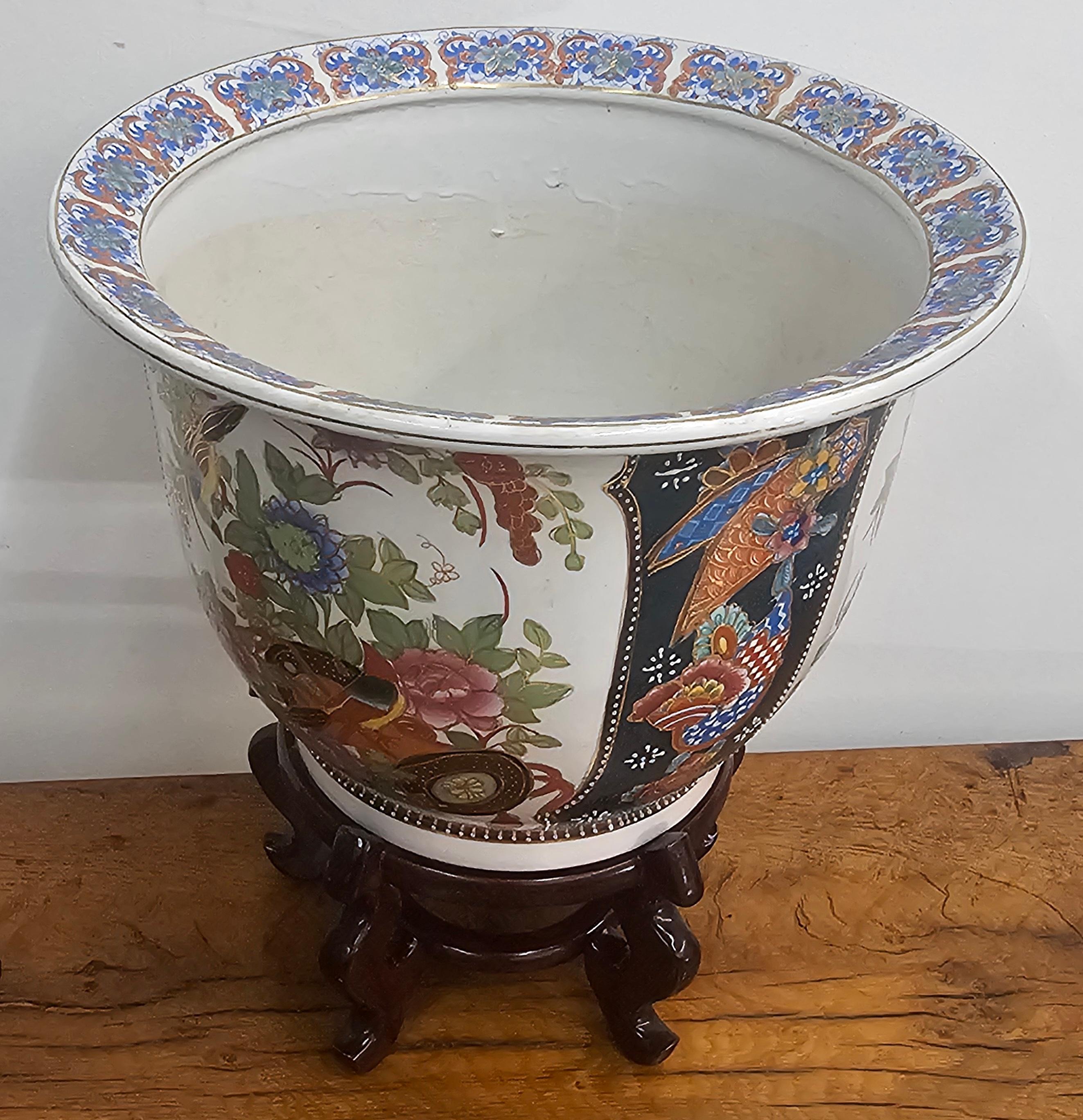 A Mid Century Chinese Hand-Painted  Porcelain Jardiniere On Hardwood Stand.
Great vintage condition
 Measures 14.5