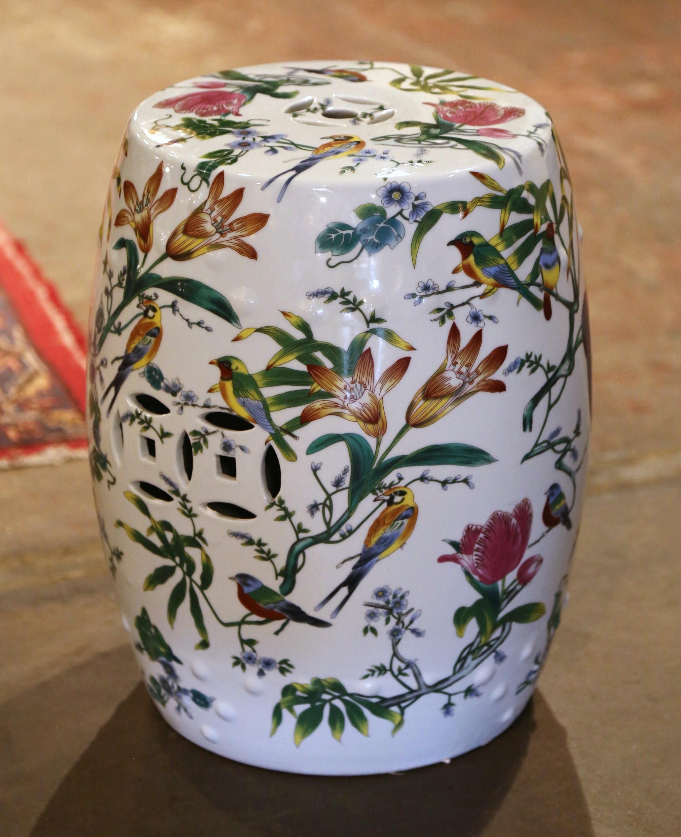 Decorate a den or a living room with this colorful vintage garden stool. Created in China, circa 1960 and round in shape, the porcelain seat is pierced on the top and around the perimeter for an intricate, sculptural effect. The exotic Asian stool