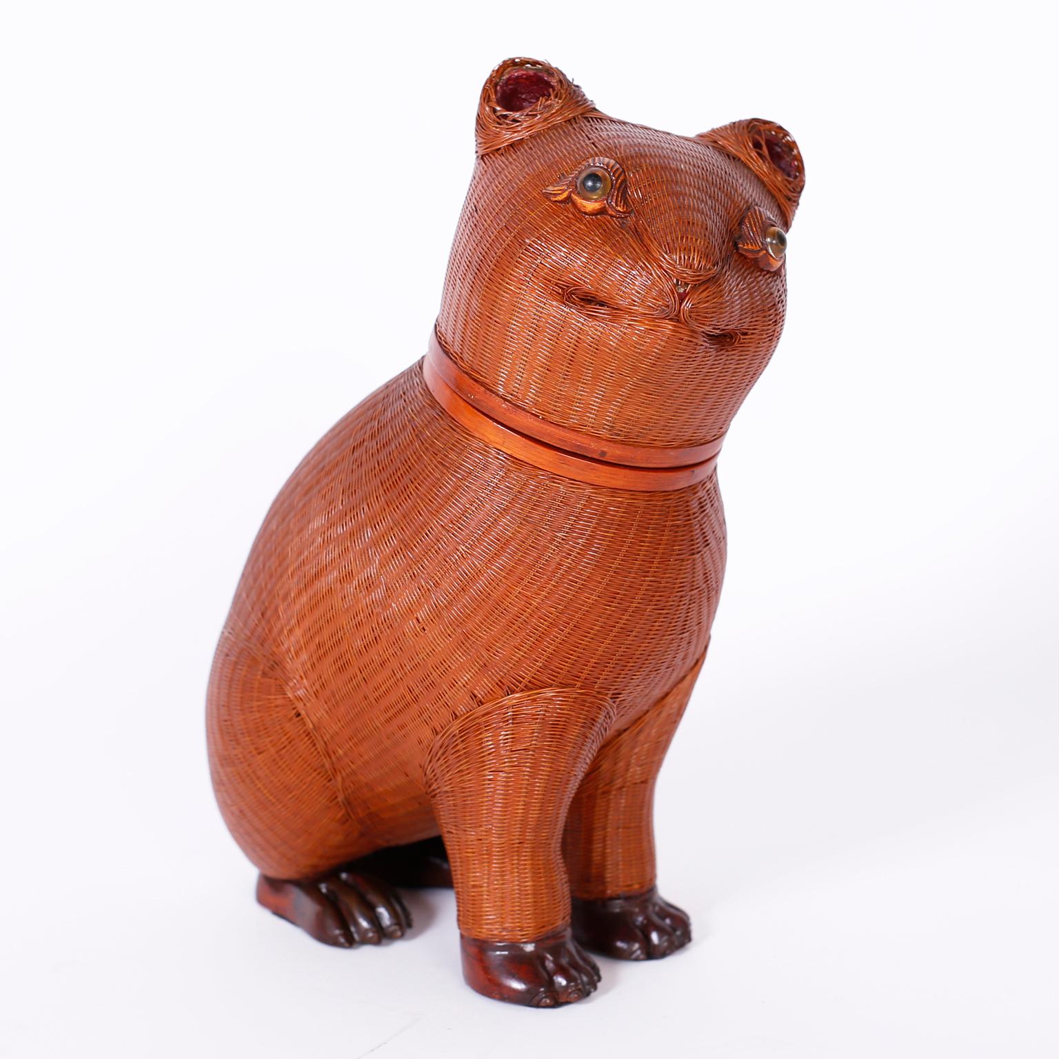 Whimsical midcentury Chinese wicker cat with its distinctive ambitious weave from the Shanghai collection with carved wood highlights and removable lid.