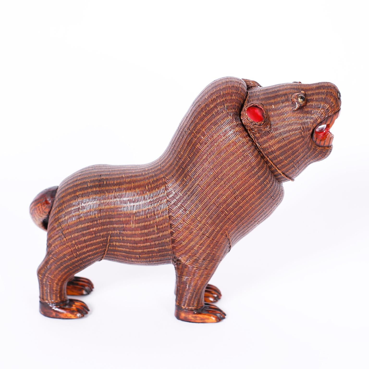 Whimsical midcentury Chinese wicker, fierce lion caught in mid roar from the famed Shanghai collection with storage under a removable head.