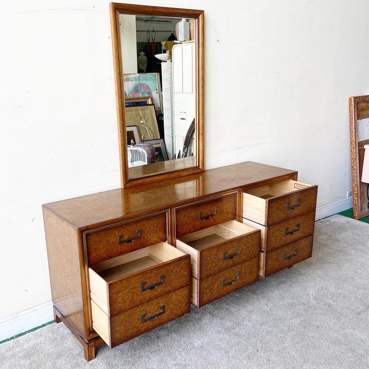 Exceptional mid century chinoiserie dresser with mirror by Founders. Features a Burl wood veneer with brass inlaid drawer pulls.

Mirror measures 27.5”W, 2”D, 43.5”H