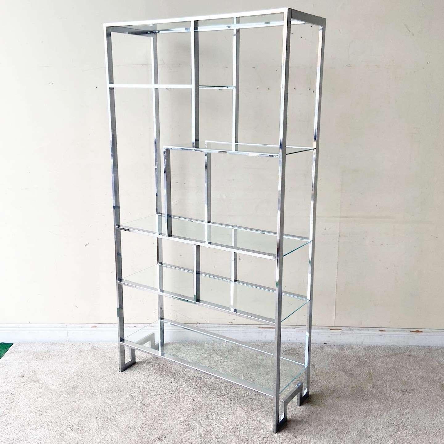 Exceptional vintage mid century modern chinoiserie chrome Etagere. Features 5 glass shelves.
