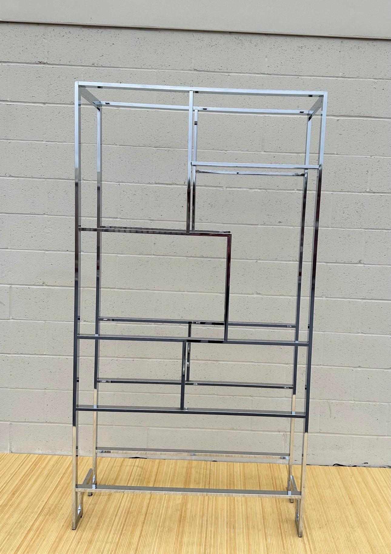 Amazing Mid Century Chinoiserie Chrome and Glass Etageres Display Case by Milo Baughman. It is no signed. From the 1970’s. In really good condition. It has three different sizes glass. The longest one is 42in by 13in. The other size glass is 27in by