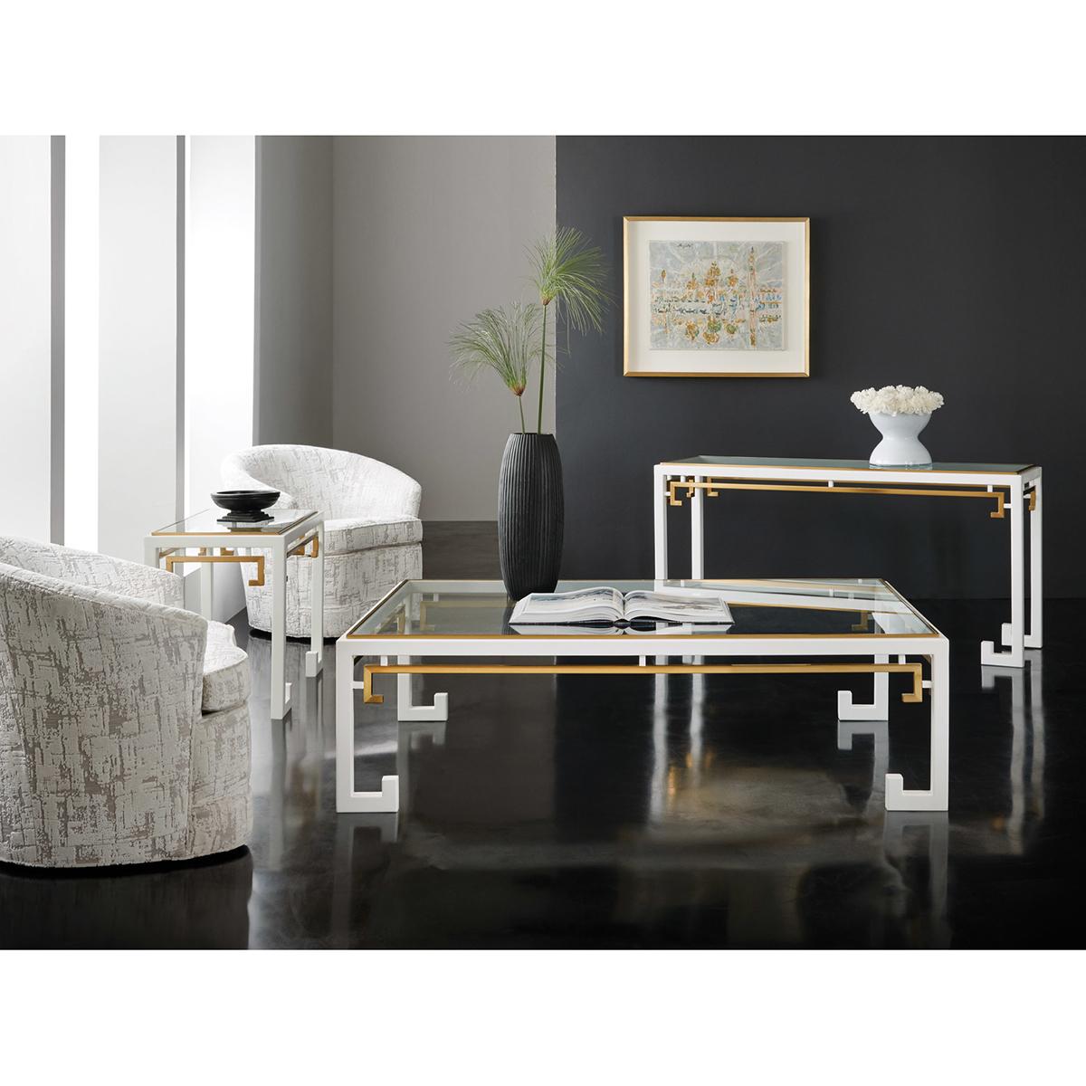 This midcentury chinoiserie console table is an exquisite blend of classic Asian and modern midcentury styles. With its striking white paint, brass metal accents, and clear glass top, it is a perfect example of functional art that will add a touch