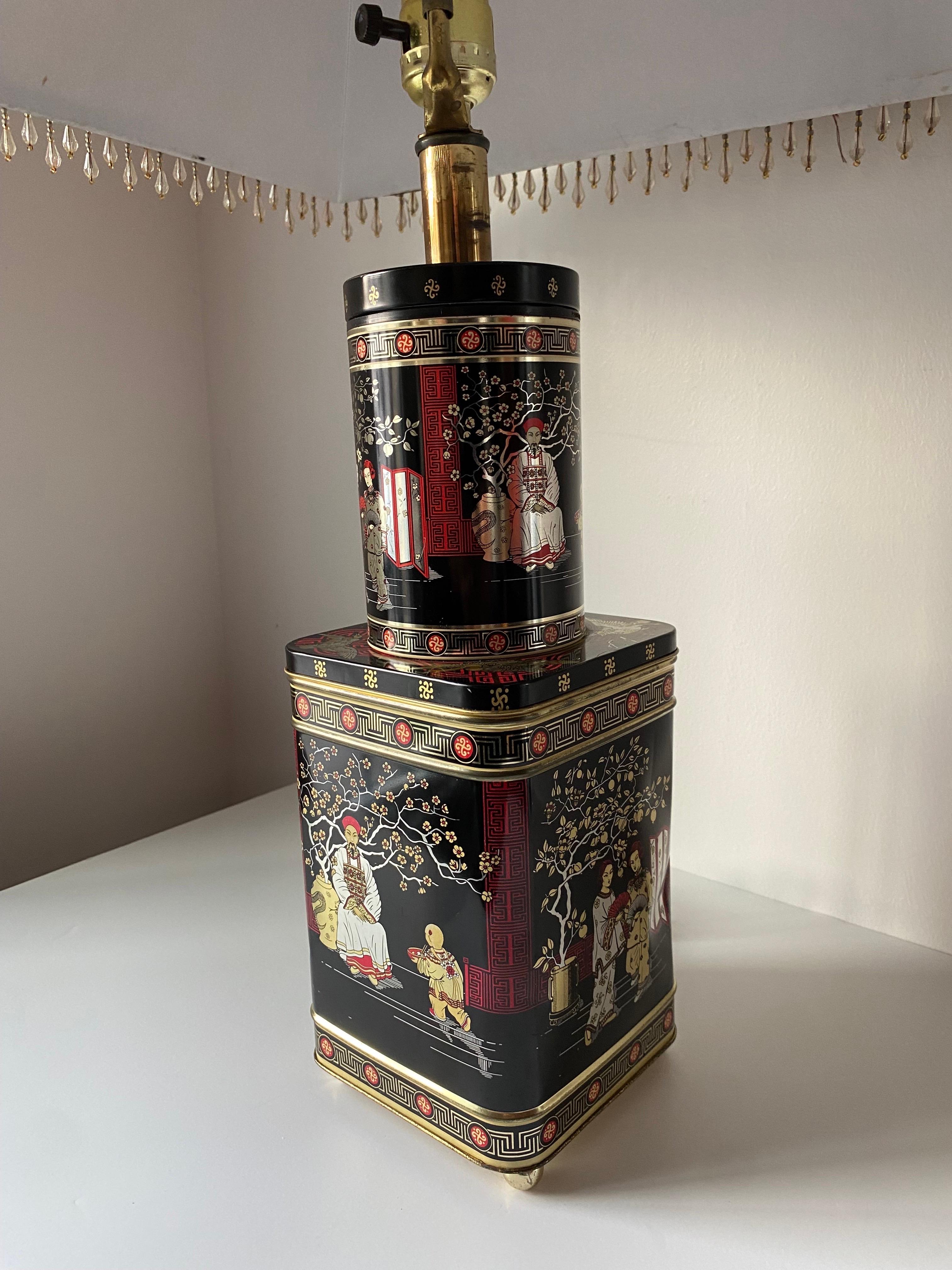 Beautiful vintage lamp crafted from vintage English tea tin canisters.  This is a beautiful example of how design visions in the past crafted everyday objects to repurpose them into decorative wonders.  Following Chinoiserie style, you can see the